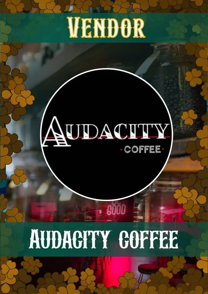Sign for Audacity Coffee shop with the brand logo and name, decorated with shamrock leaf patterns.