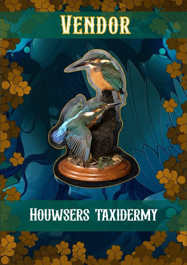 Decorative display featuring taxidermy of two kingfishers mounted on a wooden base with a blue and floral background. The text reads 'VENDOR' at the top and 'HOUWERS TAXIDERMY' at the bottom.