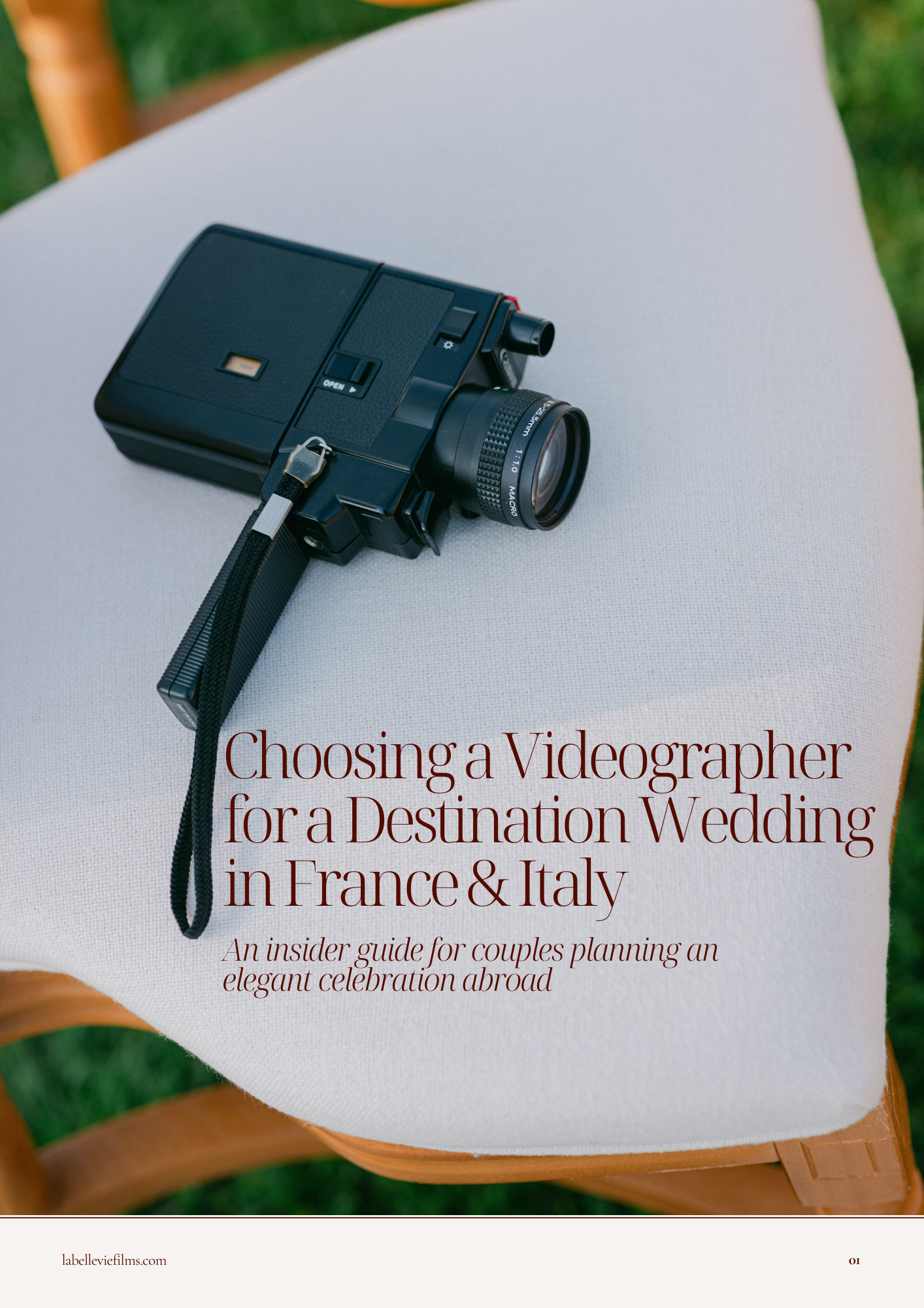 A vintage video camera placed on a white fabric-covered chair outdoors, with green grass visible in the background. The cover text discusses choosing a videographer for a destination wedding in France and Italy.