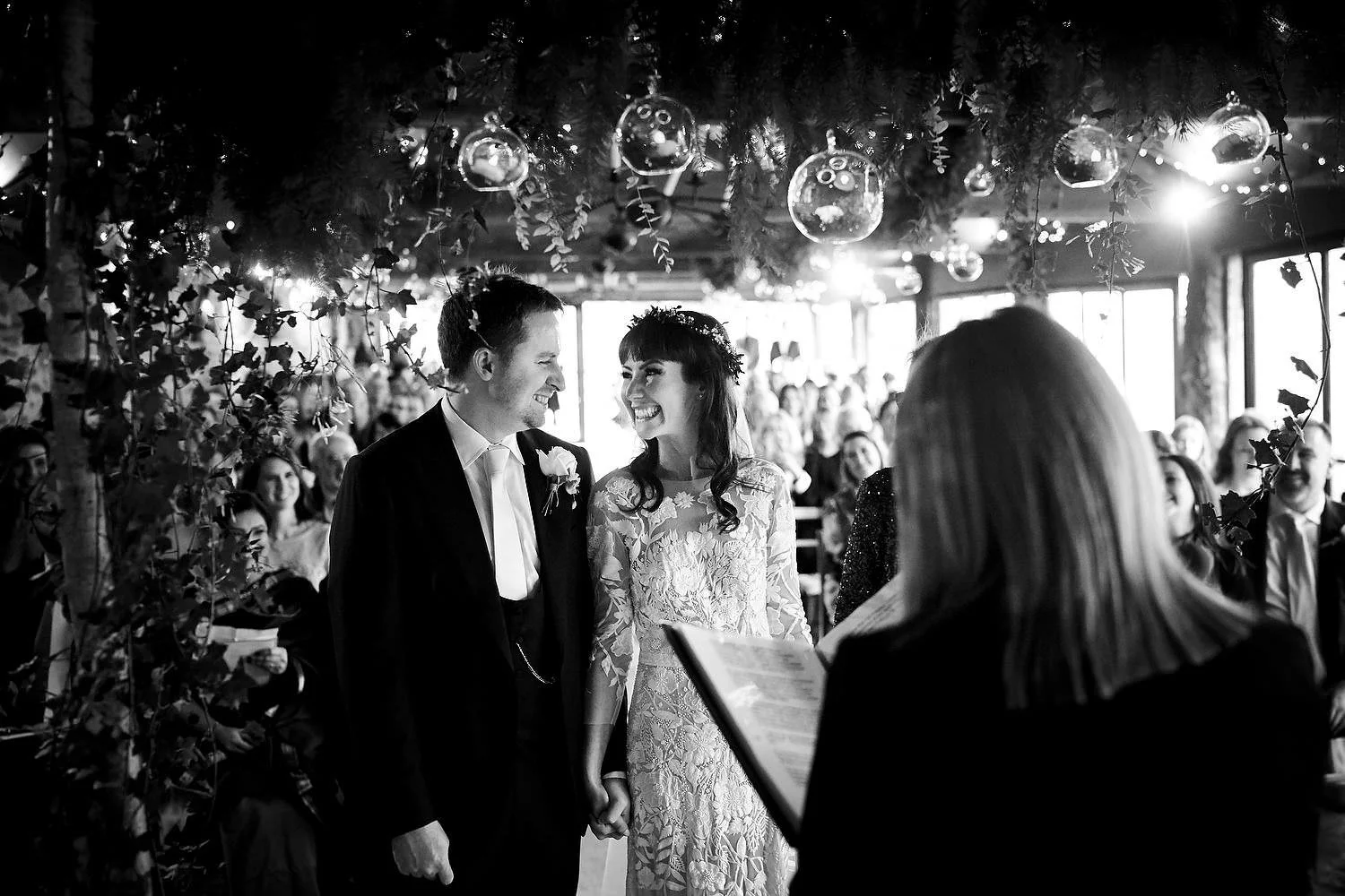 bride and groom under winter chuppah