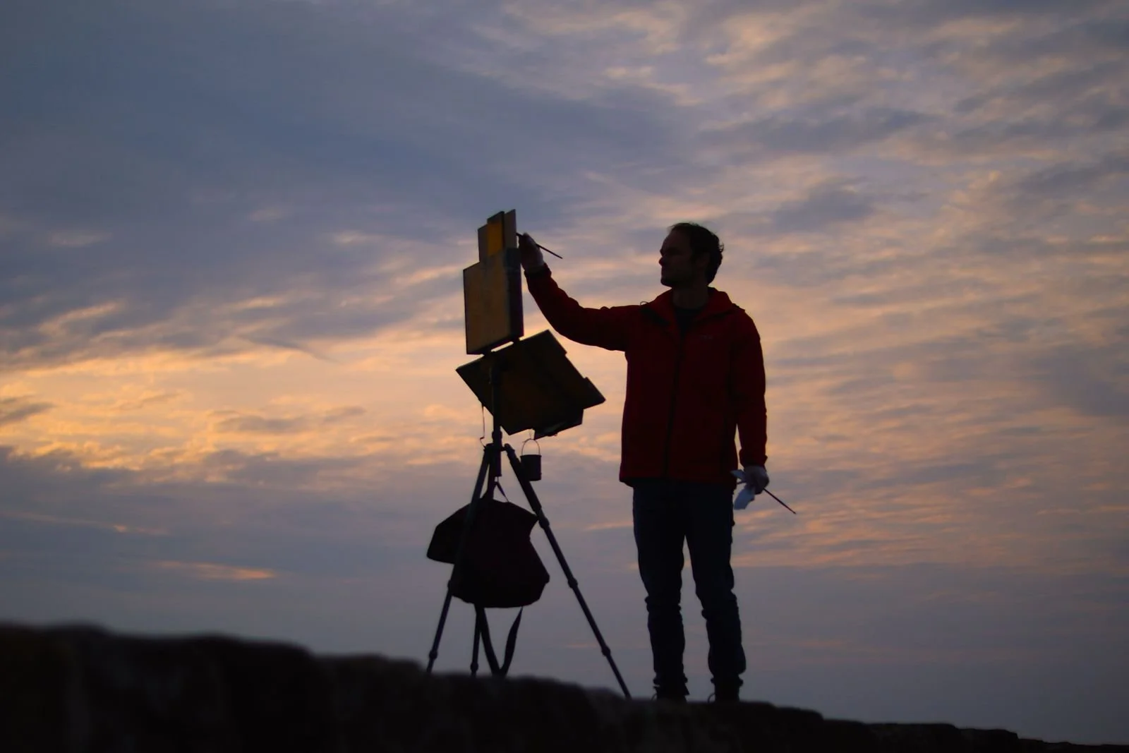 Jonathan Koetsier painting on St Andrews Pier, photo by Jacob Topen