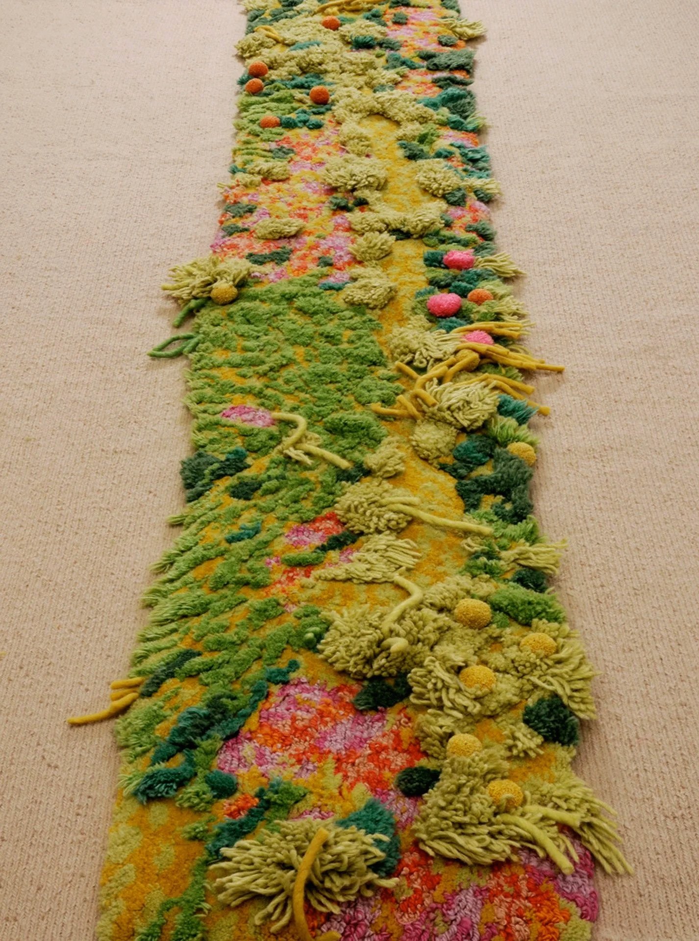 'Vertical Garden' detail. The base is a woven linen, with a riot of different weaving techniques in the central. 