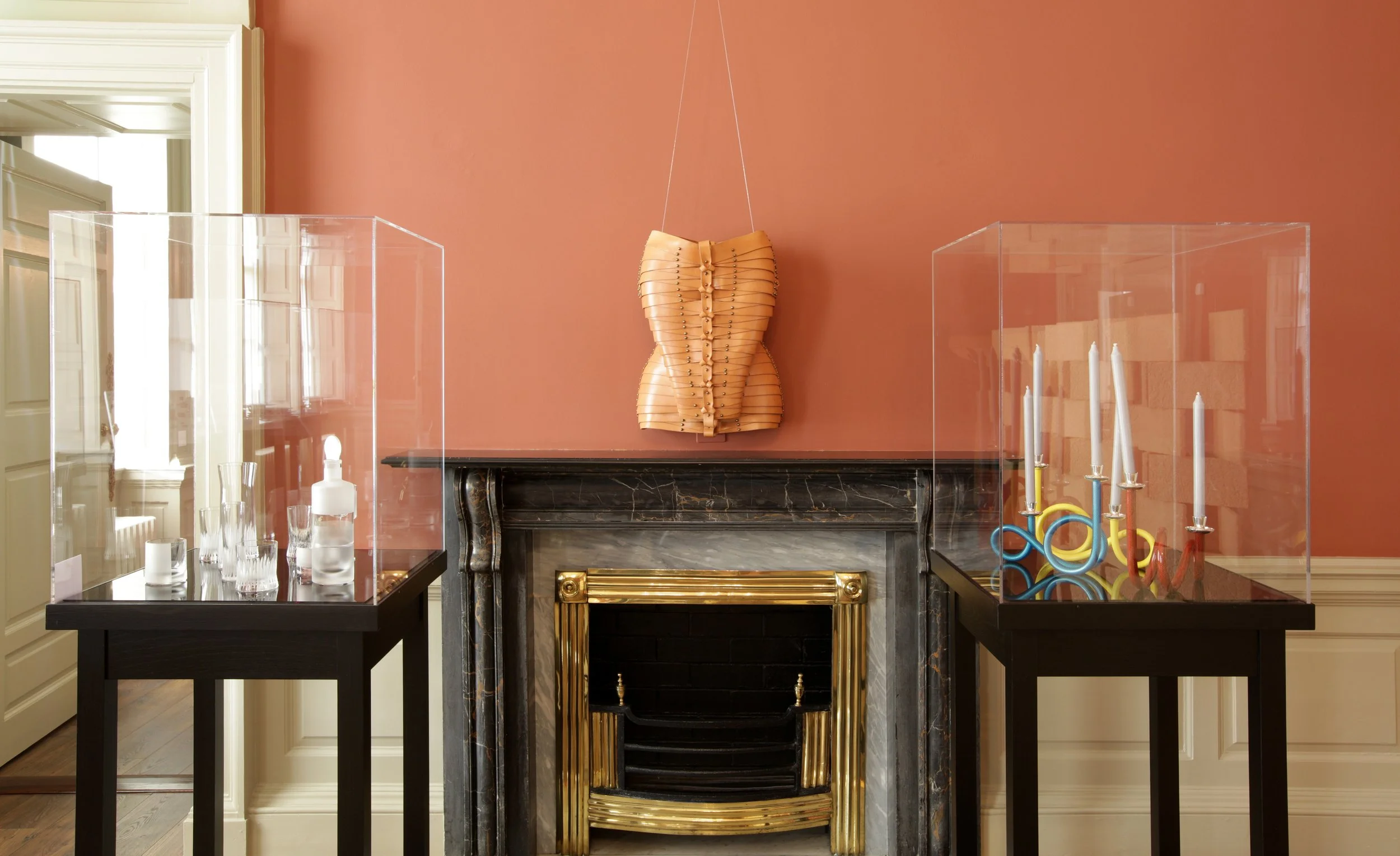 Room 2, Playing with Tradition,J. Hill Standard cut glass, Una Burke leather bust, candleholder De Vecchi.
