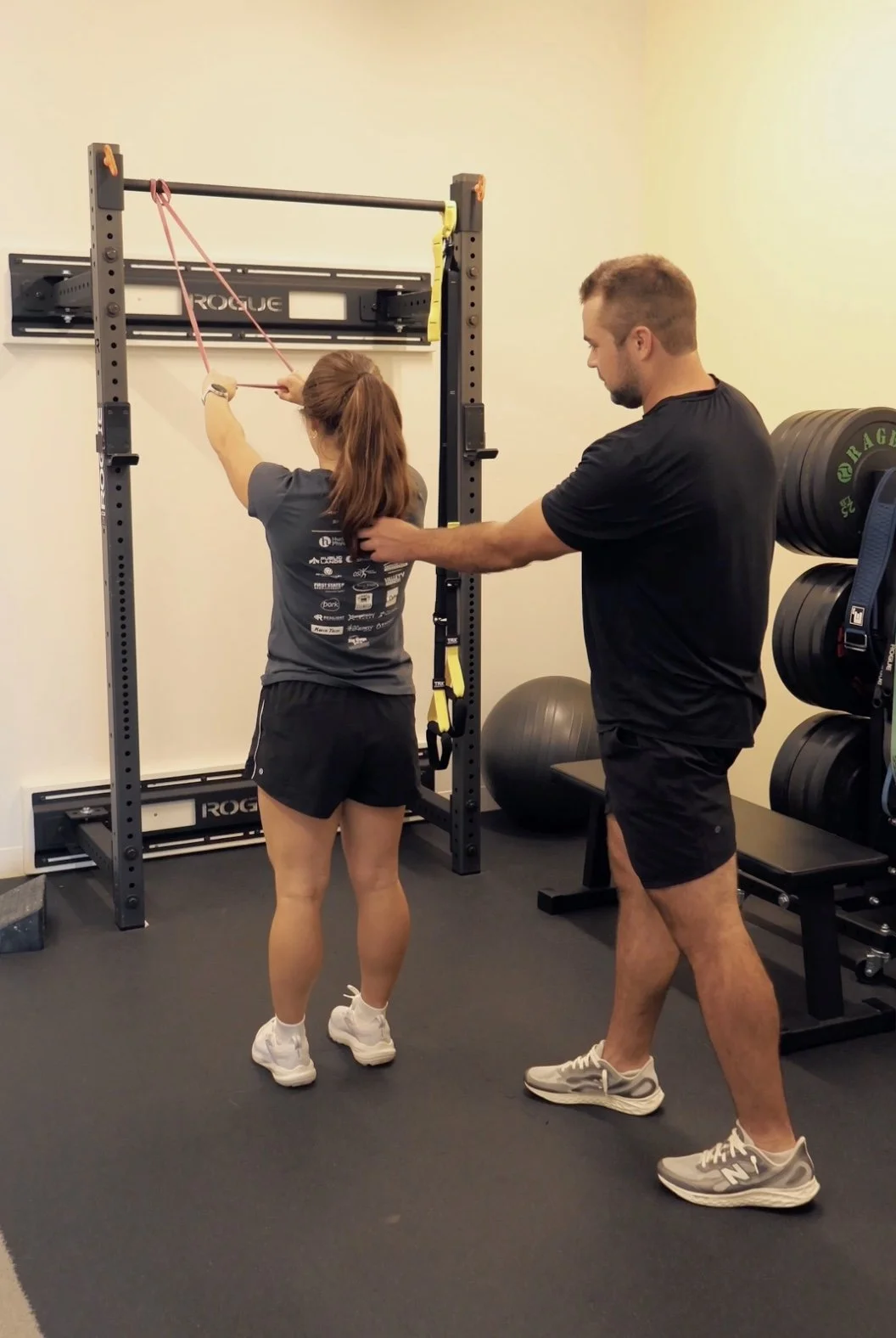 Rehab and performance coaching with resistance band at Optimum Health