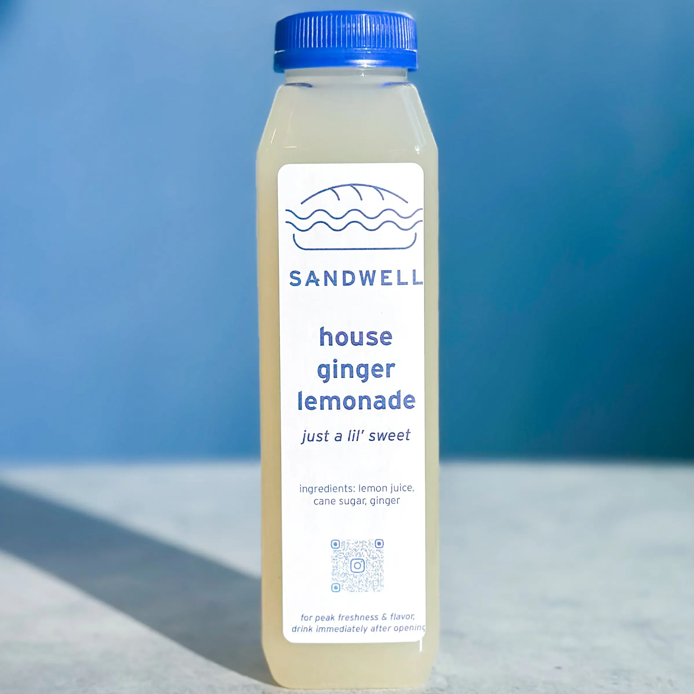 Bottle of Sandwell's House Ginger Lemonade — homemade with a hint of ginger, available at Sandwell sandwich shops in NYC