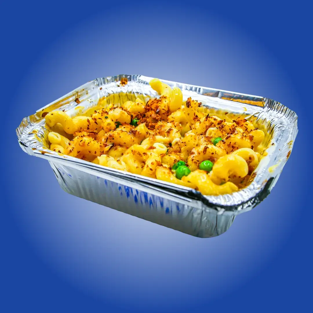 Sandwell's Mac and Cheese and Peas — cavatappi pasta in house-made cheddar cheese sauce with green peas and toasted breadcrumbs, available at Sandwell sandwich shops in NYC