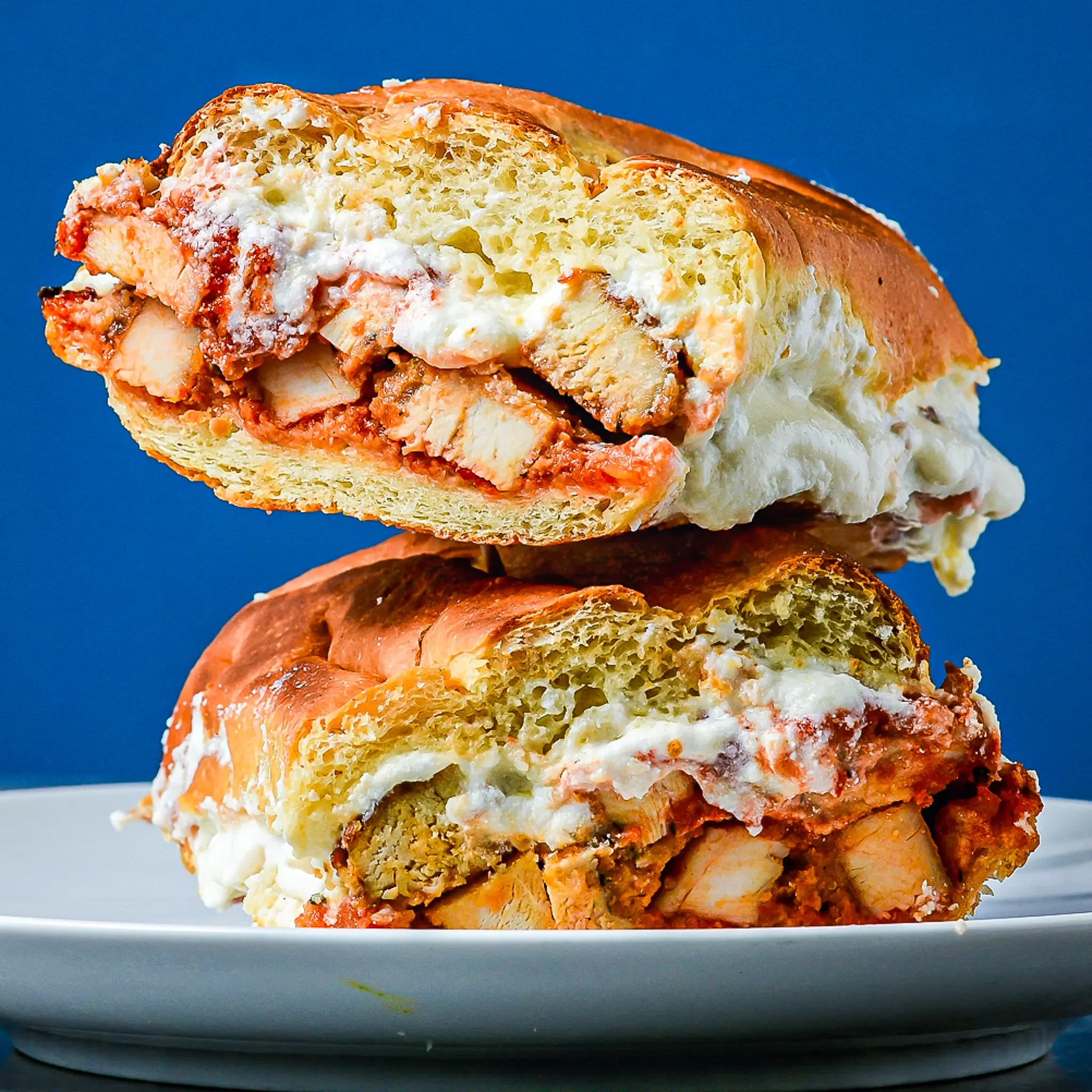 Sandwell's Chicken Parm sub — baked chicken cutlet with whipped burrata, marinara, parmesan, and house-infused basil oil on a house-baked semolina roll, available at Sandwell sandwich shops in NYC