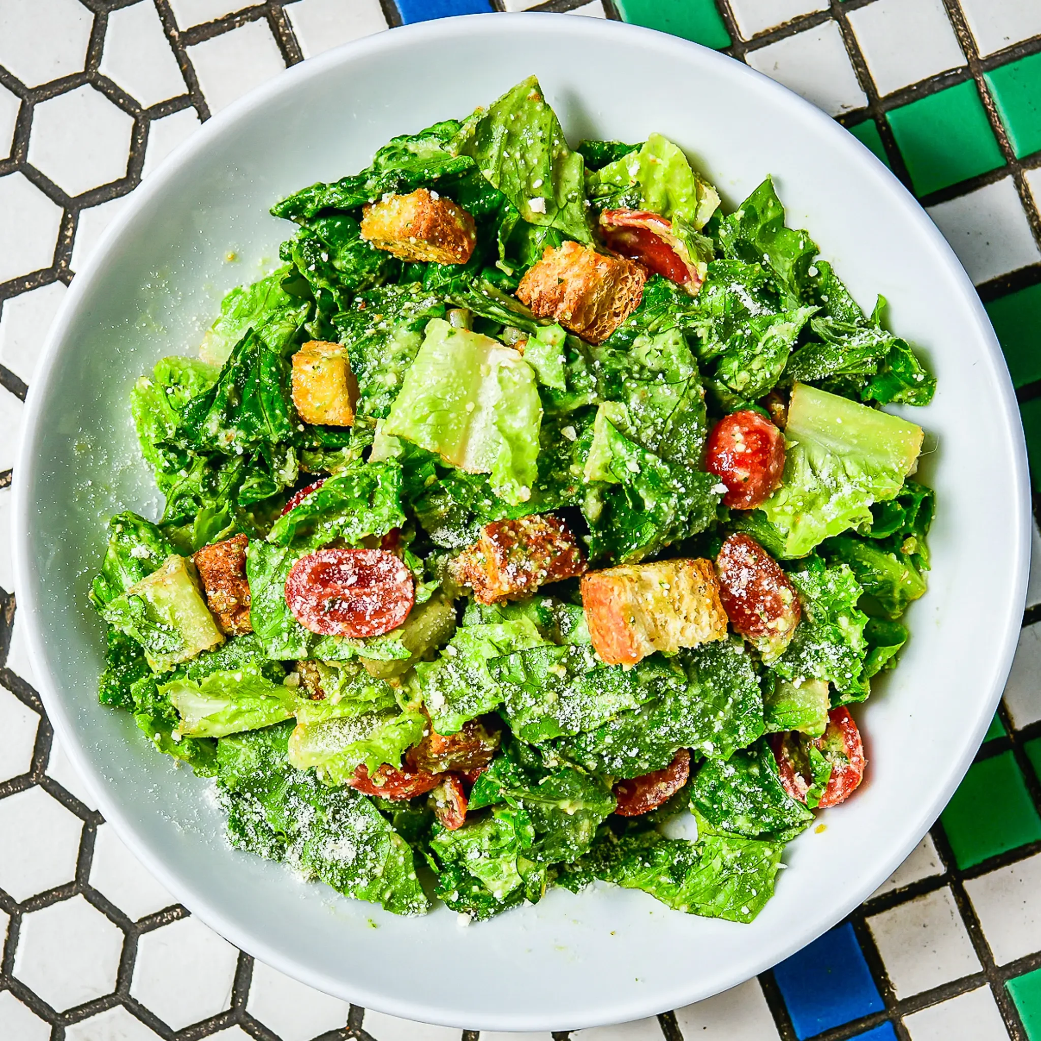 Sandwell's Green Goddess Caesar Salad — romaine lettuce with green goddess caesar dressing, parmesan, parmesan croutons, and cherry tomatoes, available at Sandwell sandwich shops in NYC