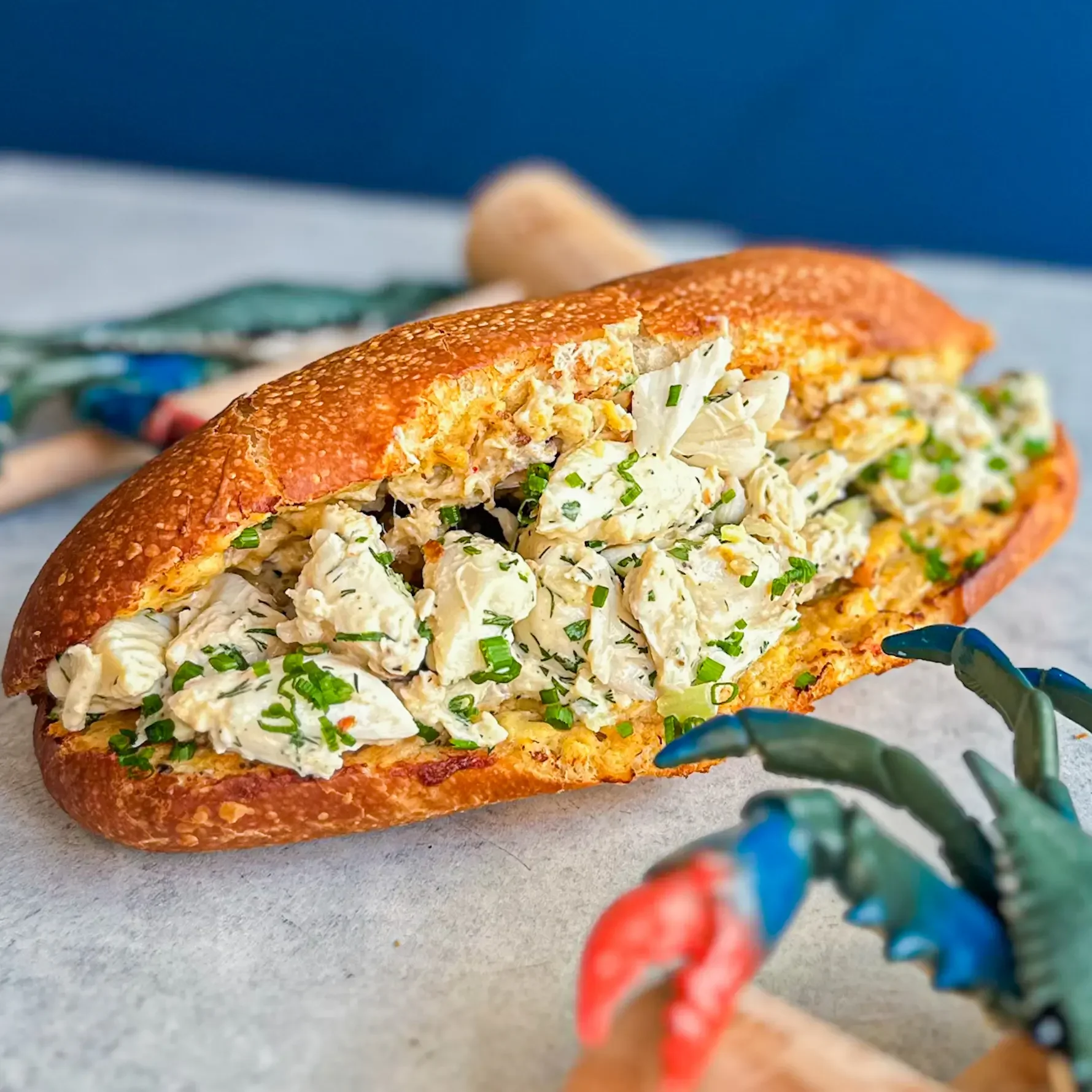 Sandwell's Bawlmer Crab Roll, Hon Limited Time Special Offer — toasty maryland crab dip, 6 oz cold blue crab salad, old bay, and chives on a house-baked semolina roll, available at Sandwell sandwich shops in NYC