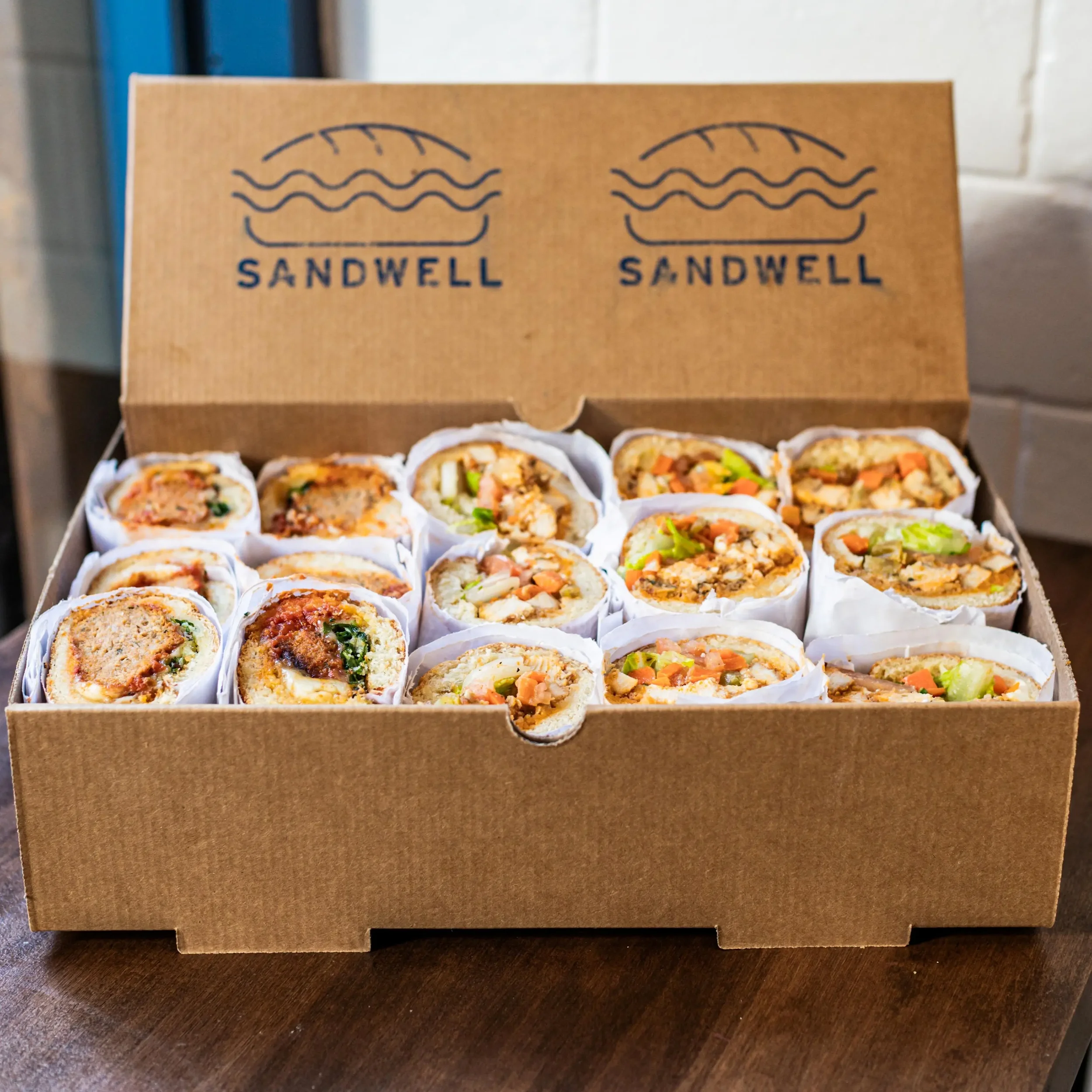 Sandwell's Gameday Sandwich Box for catering — featuring Buffalo Chicken Subs and Turkey Meatball Subs on house-baked semolina bread, available in NYC