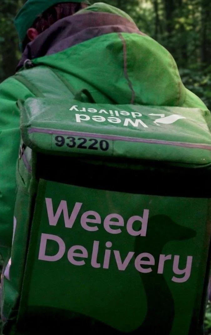 Image of weed delivery driver with a bag