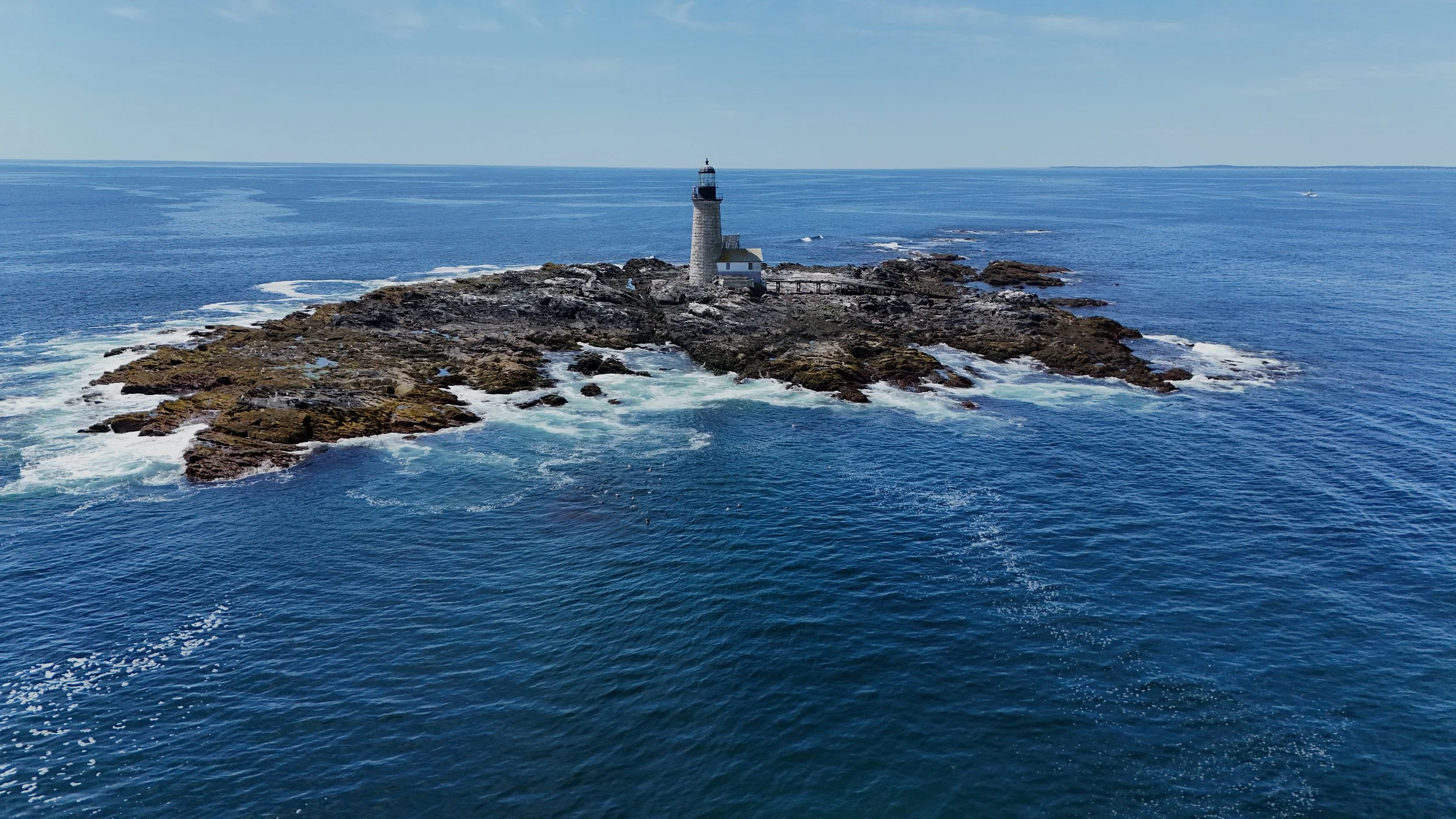 "Halfway Rock" 
Standing alone at the edge of the sea and sky, Halfway Rock watches over the times and a silent witness to weather, whales, seals, and the passing of time in the Gulf of Maine. 