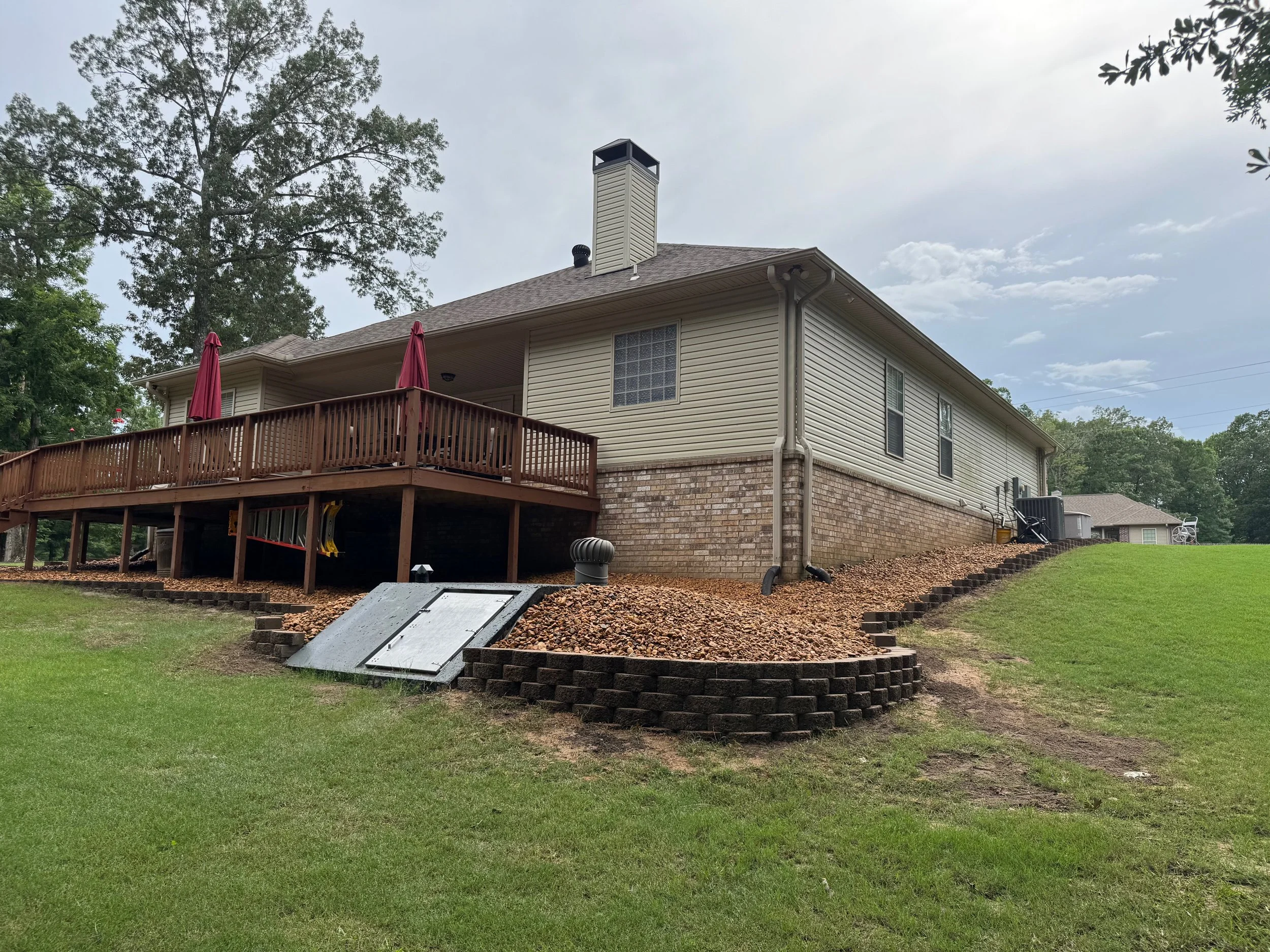 Block Border With River Rock and French Drains