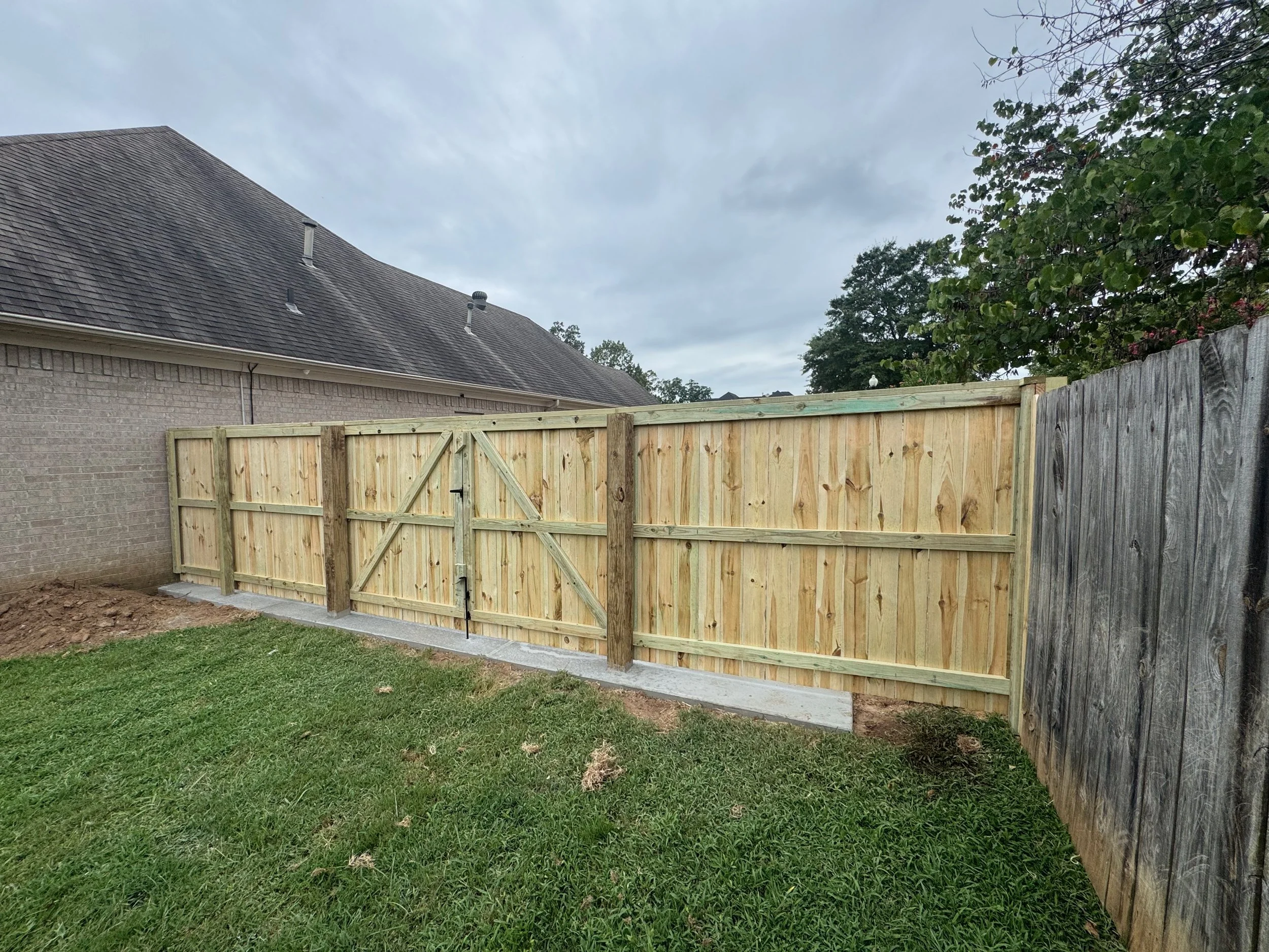Concrete Extension With Double Gate Integrated Into New Concrete Pour