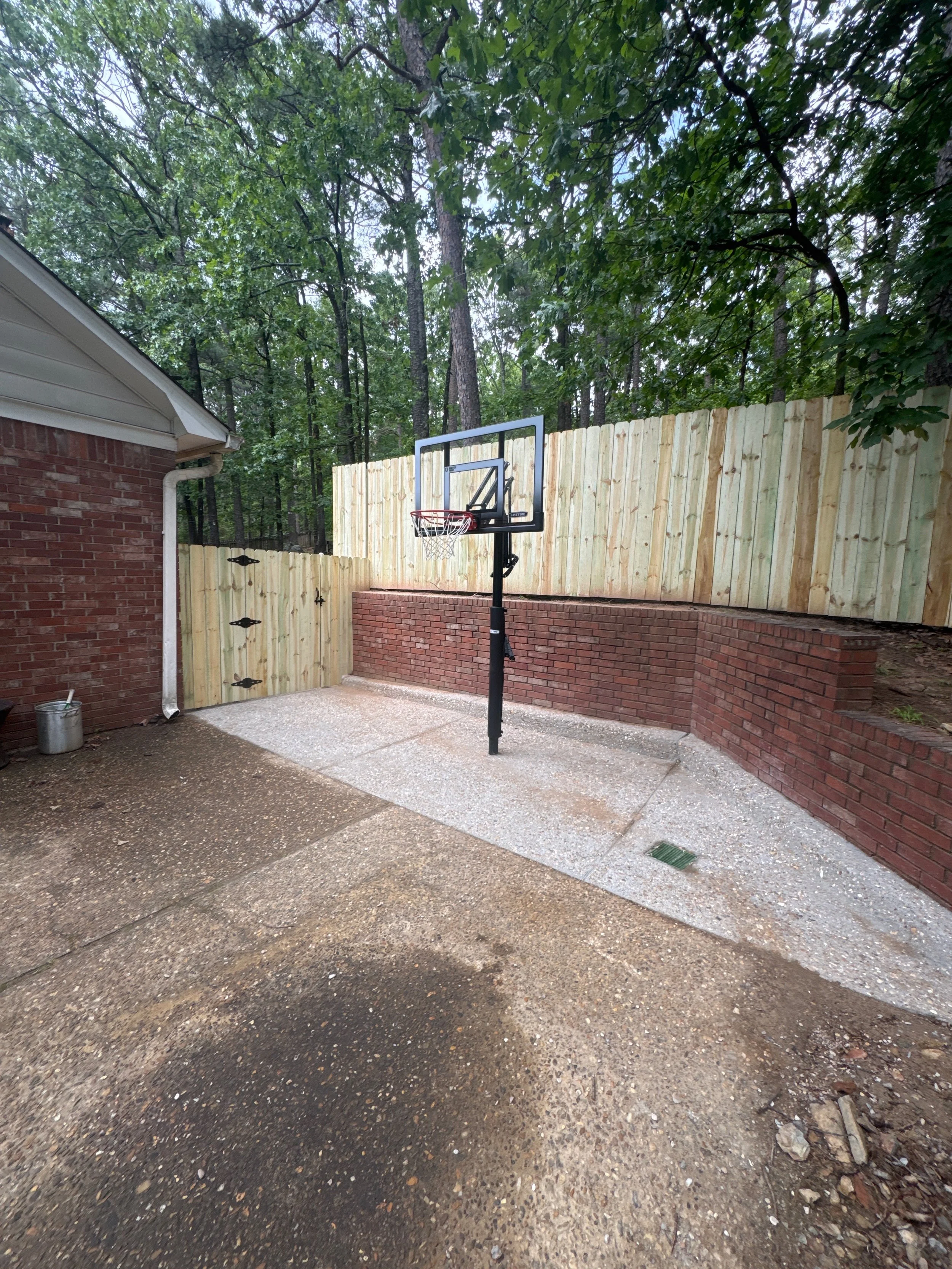 River Rock Concrete Install With New Fence and Gate