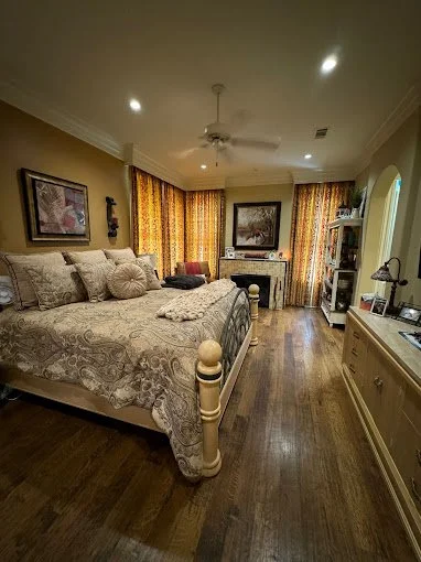 After picture of a bedroom in Highland Village after a deep cleaning.