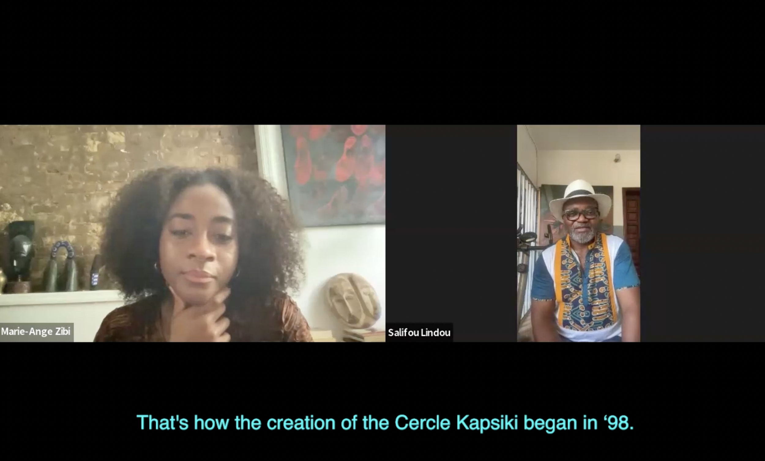 A screenshot of a video call with two participants, Marie-Ange Zibi on the left and Salifou Lindou on the right. The text at the bottom reads, "That's how the creation of the Cercle Kapsiki began in '98."