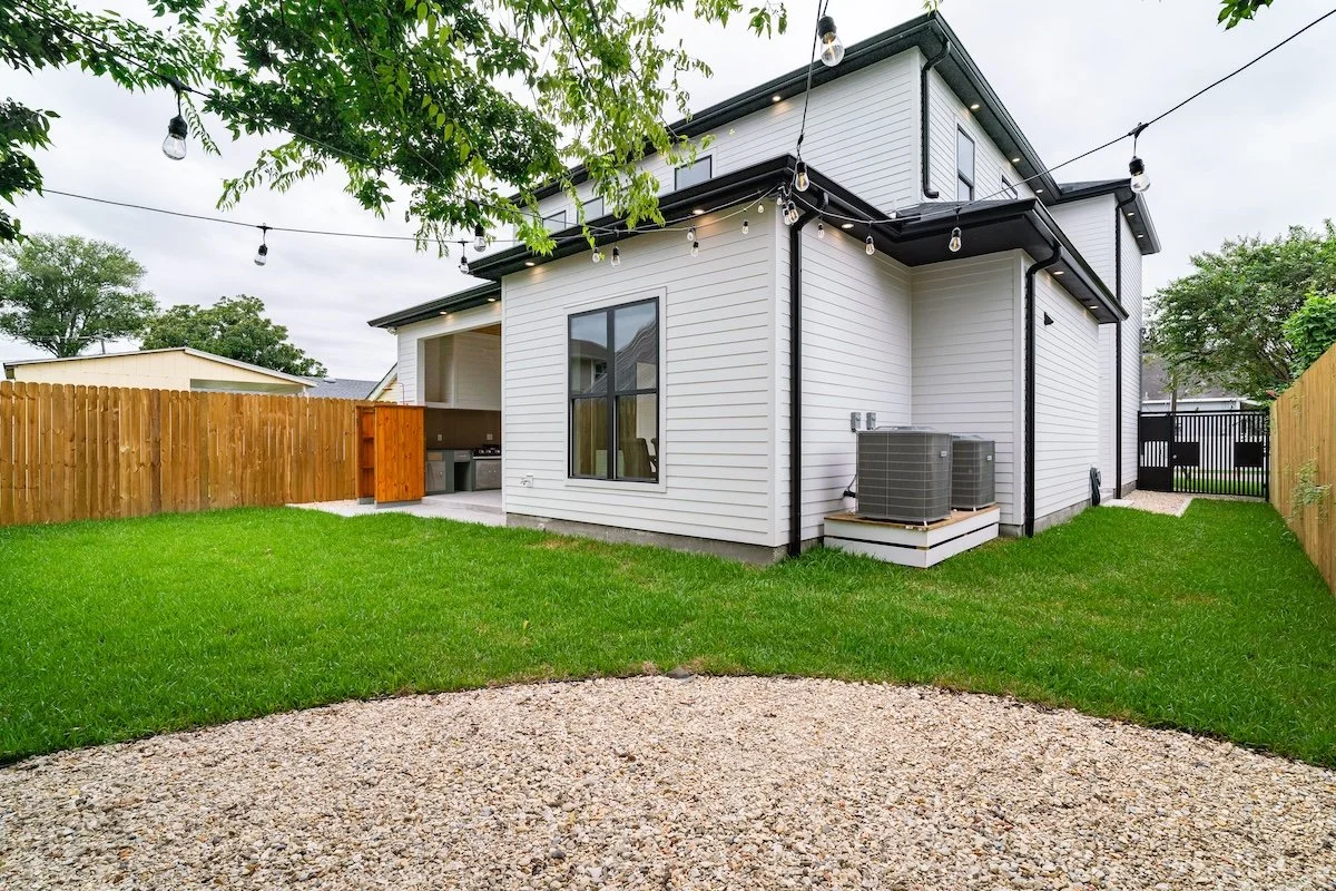 back view of home with A/C units