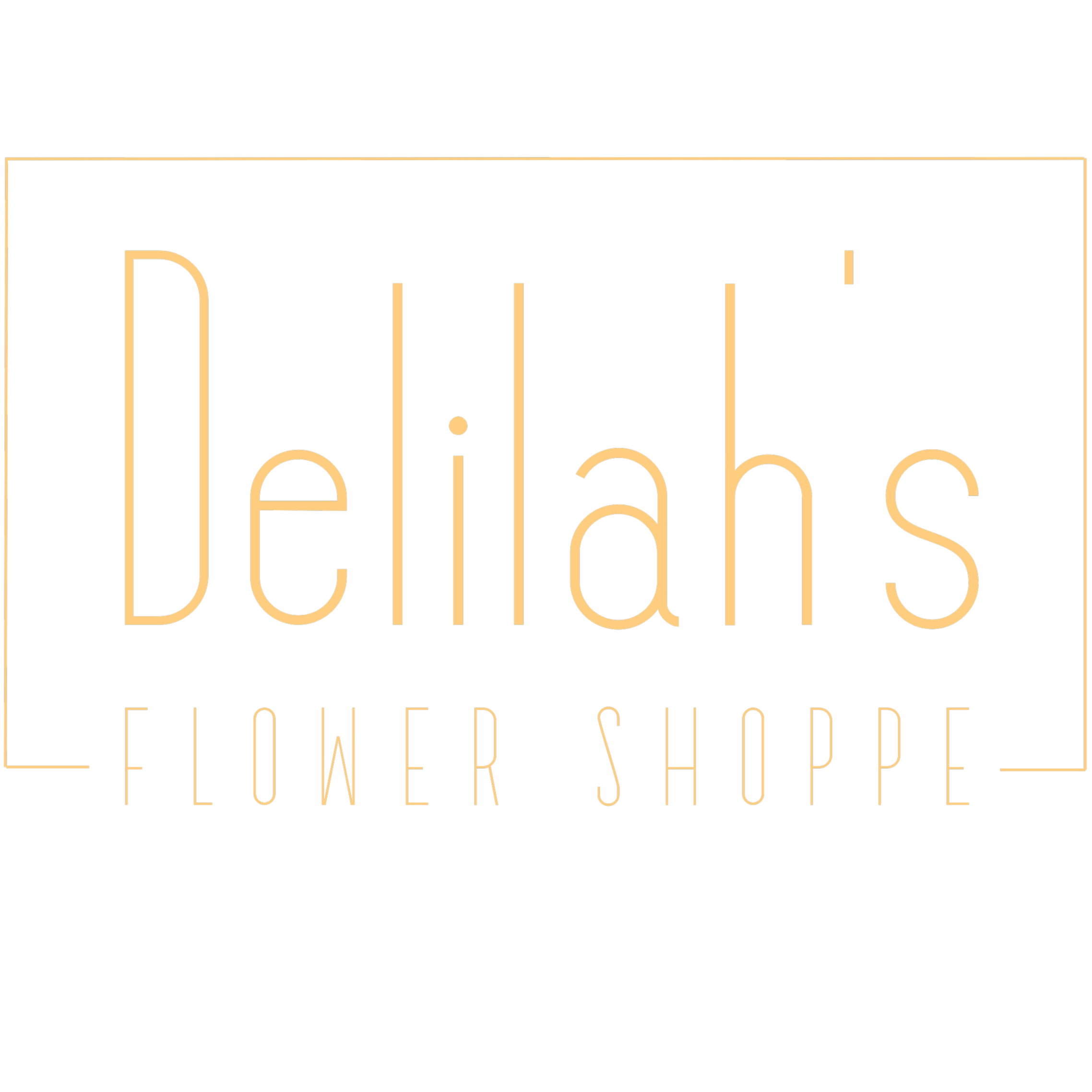 Close-up of a black sign with gold lettering that reads "The Delilah's Flower Shoppe"