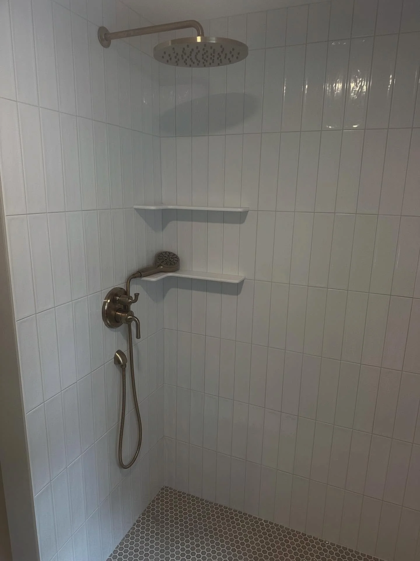 leveling up another bathroom 🛠️🚽 

the fancy overhead shower head provides a relaxing spa-like experience, you&rsquo;ll never want to get out! 🚿🧖🏽&zwj;♀️

and can we talk about the flooring? Gorgeous!! 🌸🤍

call us at (508) 543 6400 or visit ou