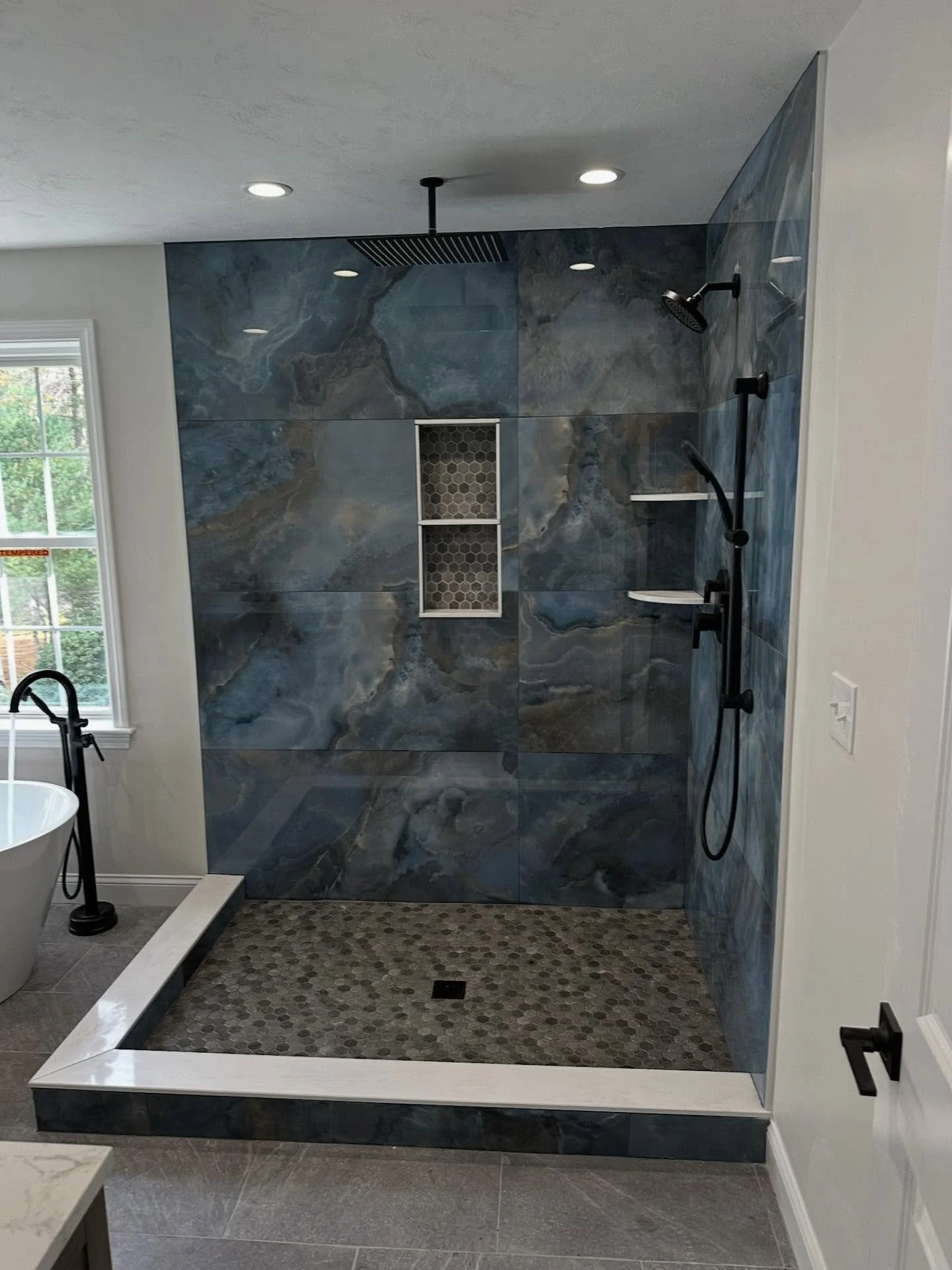 we did an addition for one of our clients, and although we LOVE our all neutral bathrooms, it&rsquo;s fun to spice 🌶️ it up sometimes! check out this blue marble shower!! 🚿🫶🏼

and is there anything better than getting home from a long day at work