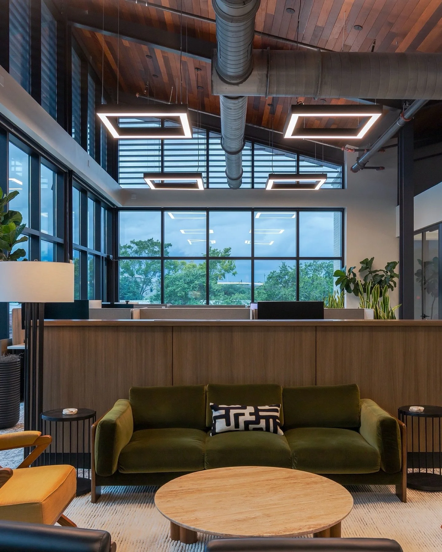 I&rsquo;m drawn to how the wood ceilings, soaring over 20 feet, transform this office. The scale is impressive, yet the warm tones and textures make the space feel surprisingly cozy and welcoming.
.
.
#archphoto #architecturalphotography #architectur