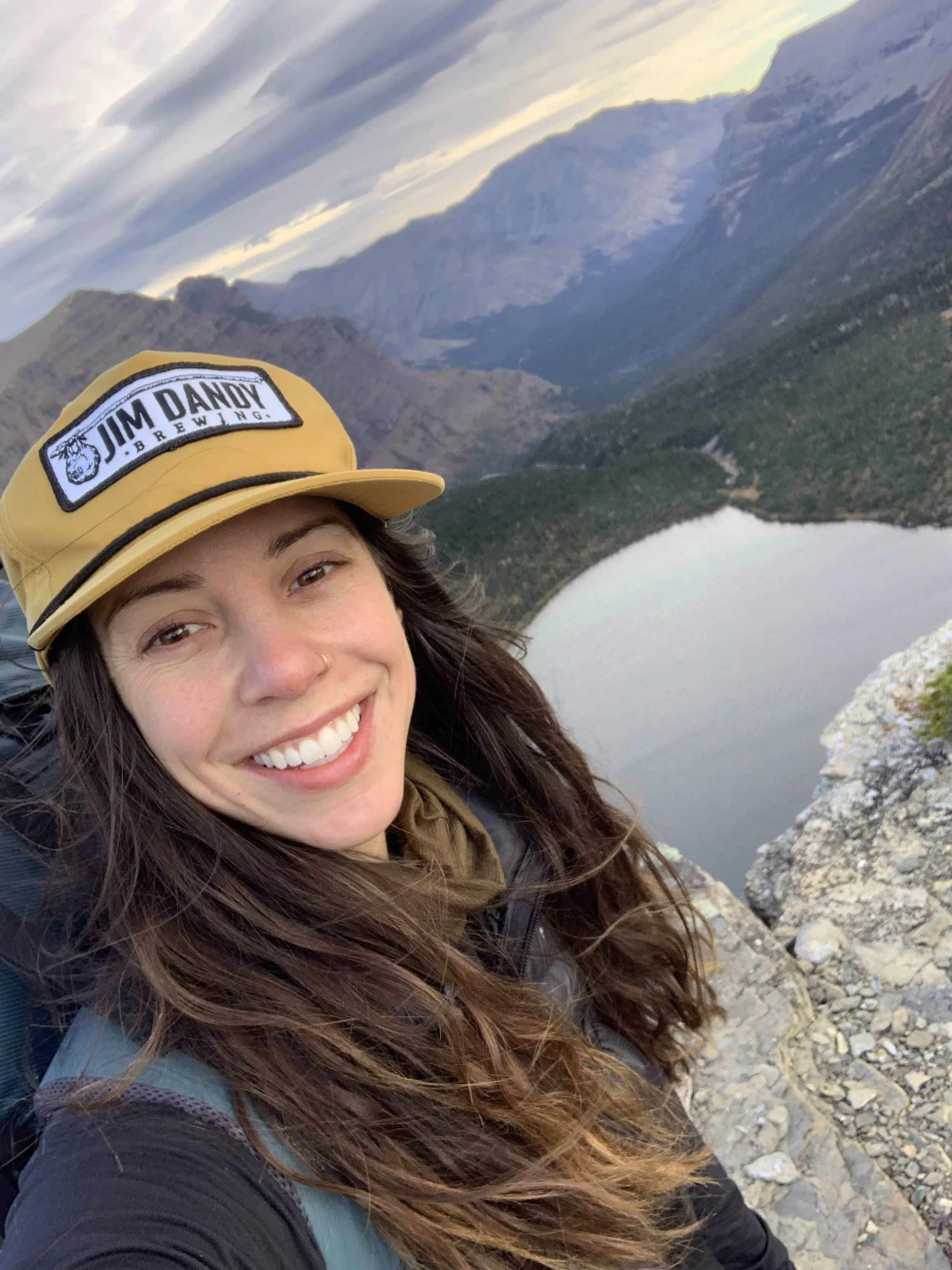woman smiling on montana mountaintop