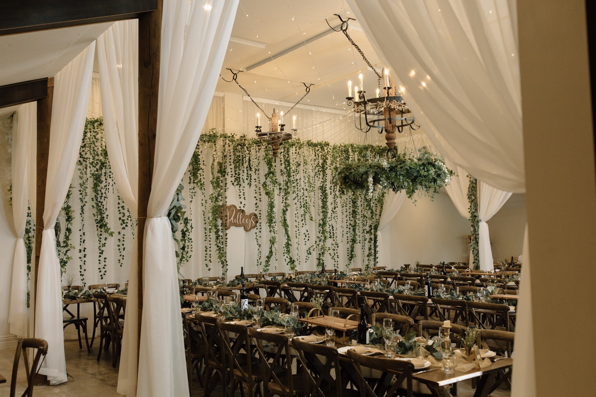 Have you seen our white curtains in action? These beautiful curtains add a touch of elegance to your reception aesthetic and look great in contrast to our wooden tables and features. Add some simple greenery to the tables and you are sorted! You don'