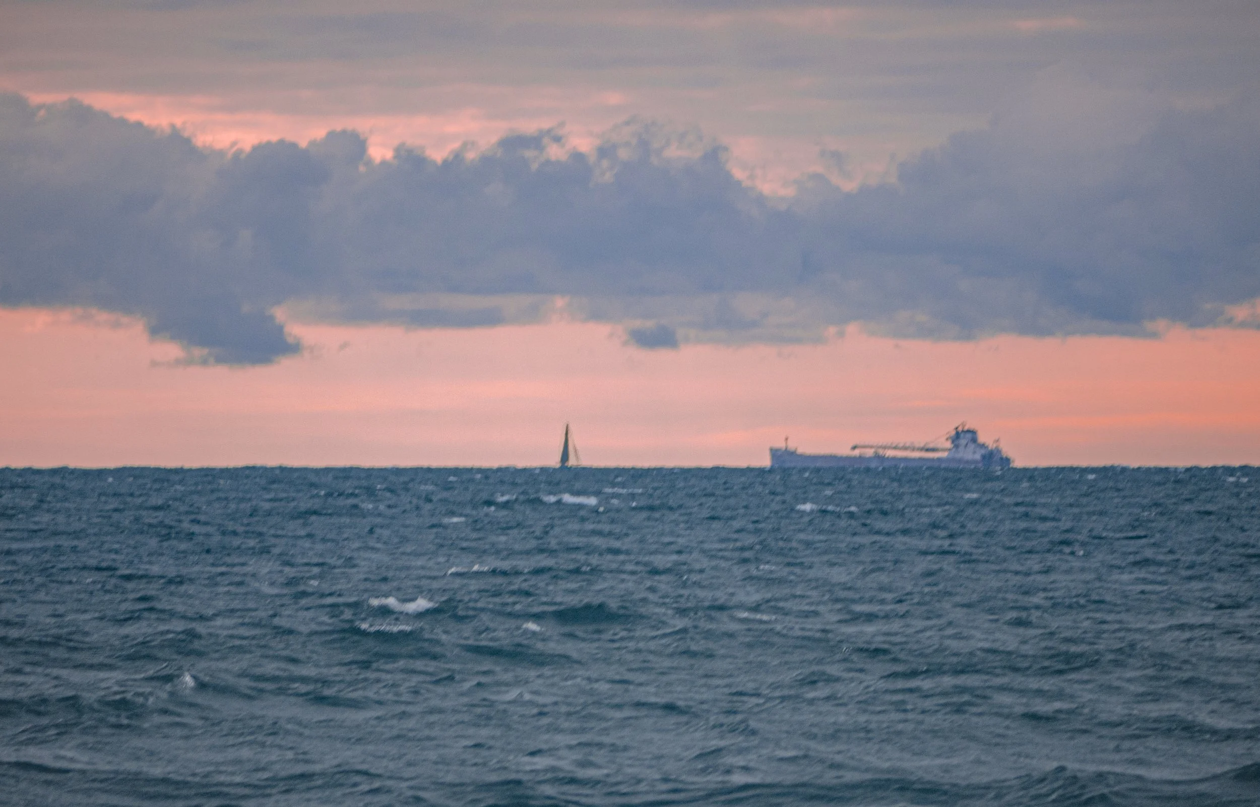 Sailboat And Freighter