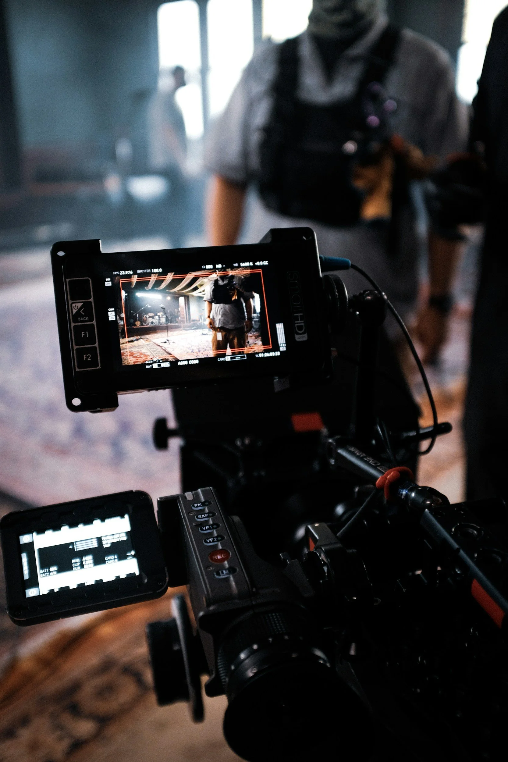 Close-up of a professional cinema camera monitor on an active film set, representing the Australian TV and movie productions that rely on two-way radio hire for clear crew communication.