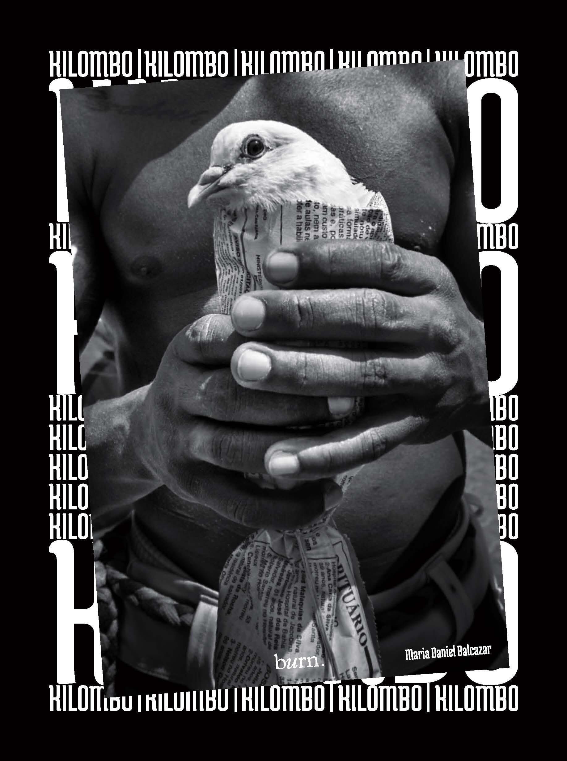 Kilombo book cover shows a dove wrapped in newspaper being held in a person's hands