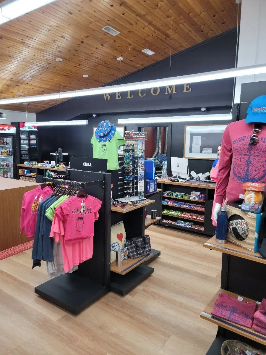 In store image with clothing sunglasses and more