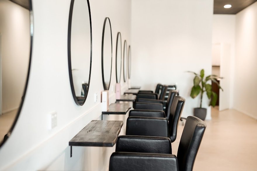 Close-up of carefully raked white sand in a Zen garden with concentric patterns.