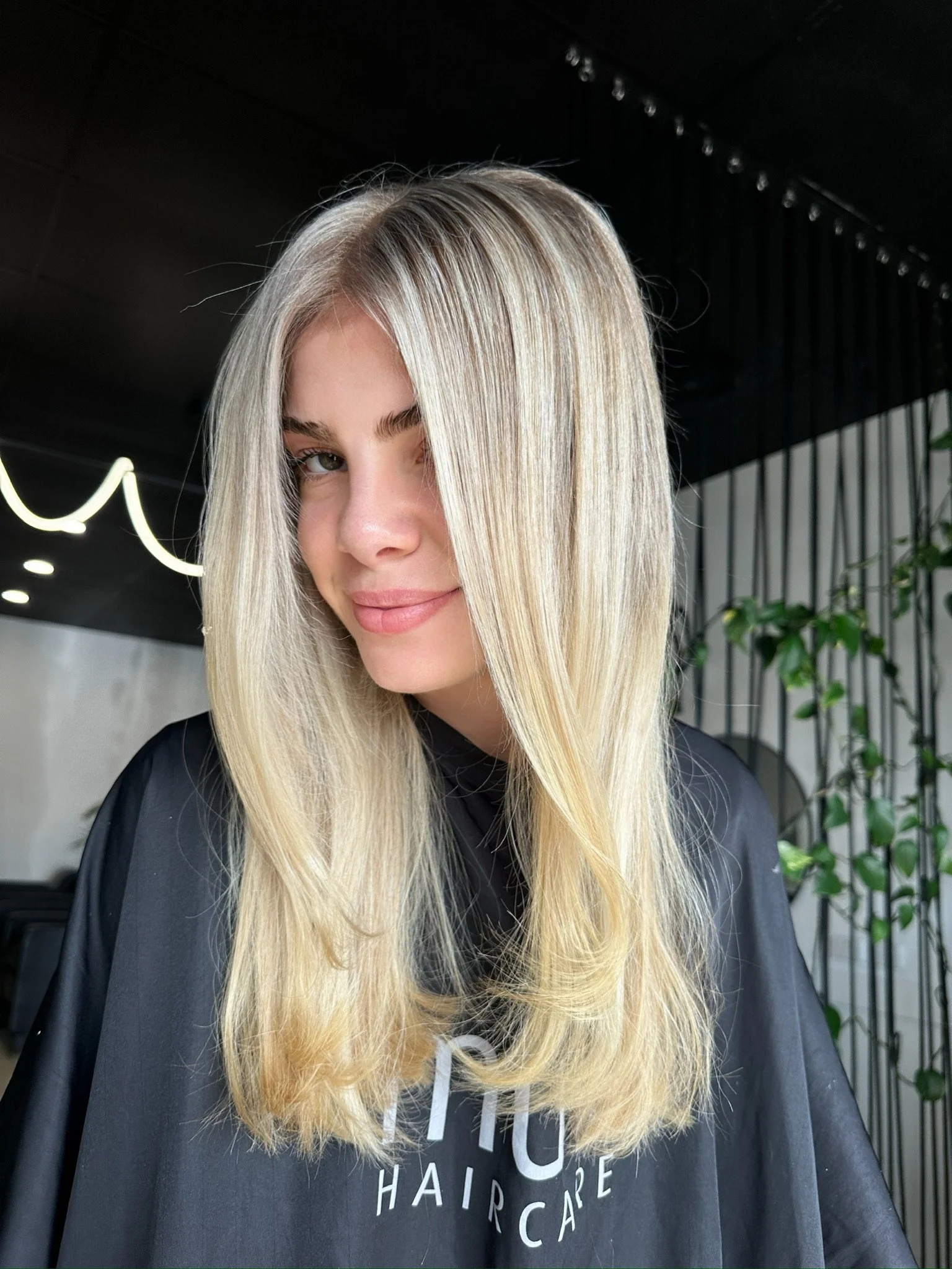 Aerial view of the ocean waves crashing onto a sandy beach.