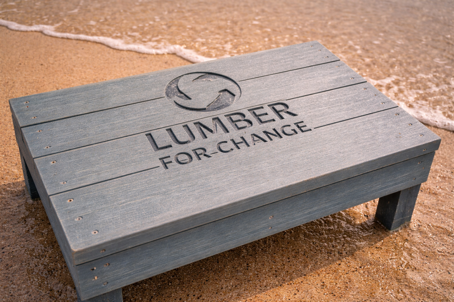 Recycled bench at water's edge.png