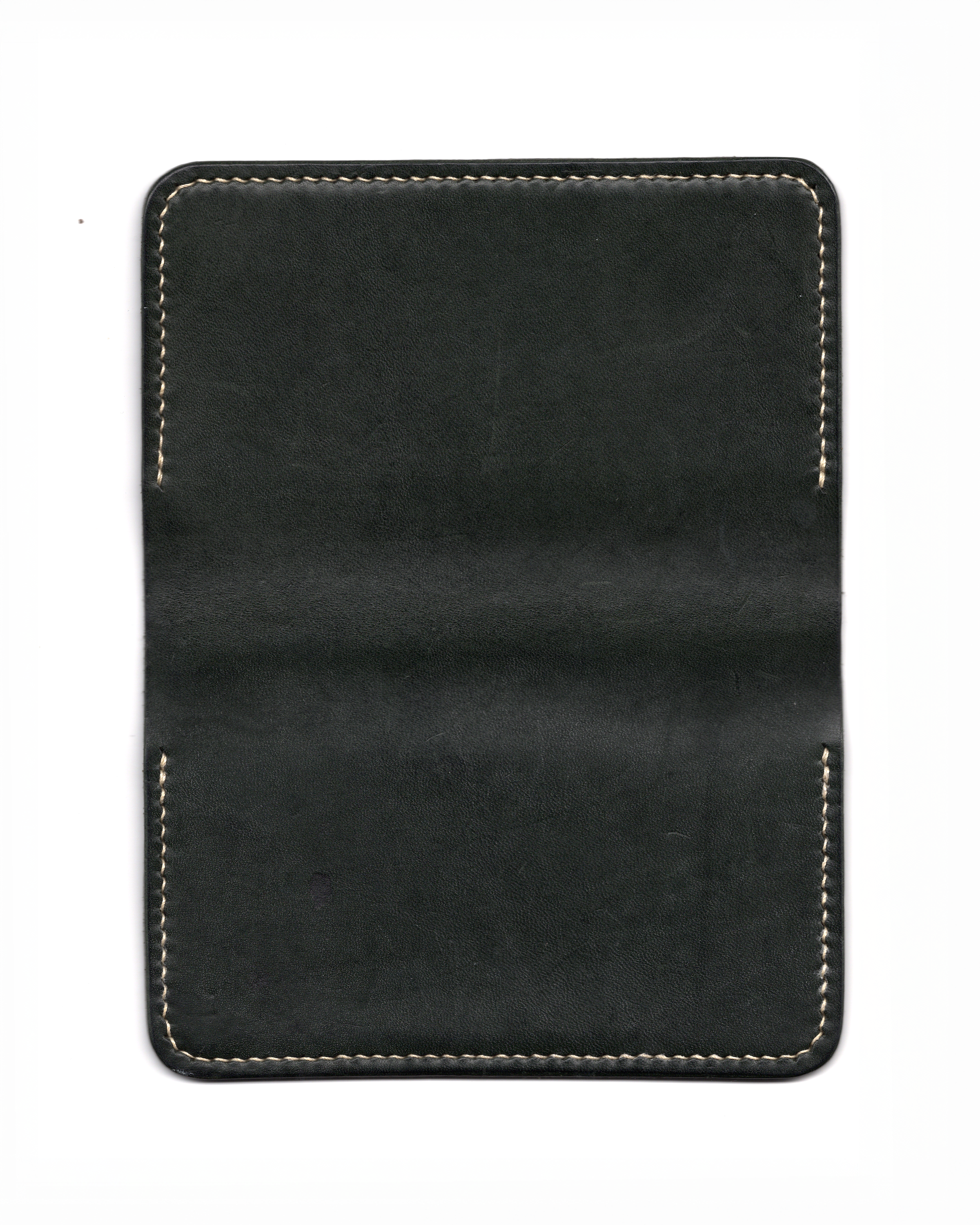 Notebook Cover — Saddle-Stitched Construction
A hand-stitched leather notebook cover developed using traditional saddle-stitch technique, emphasizing structural balance and edge refinement.