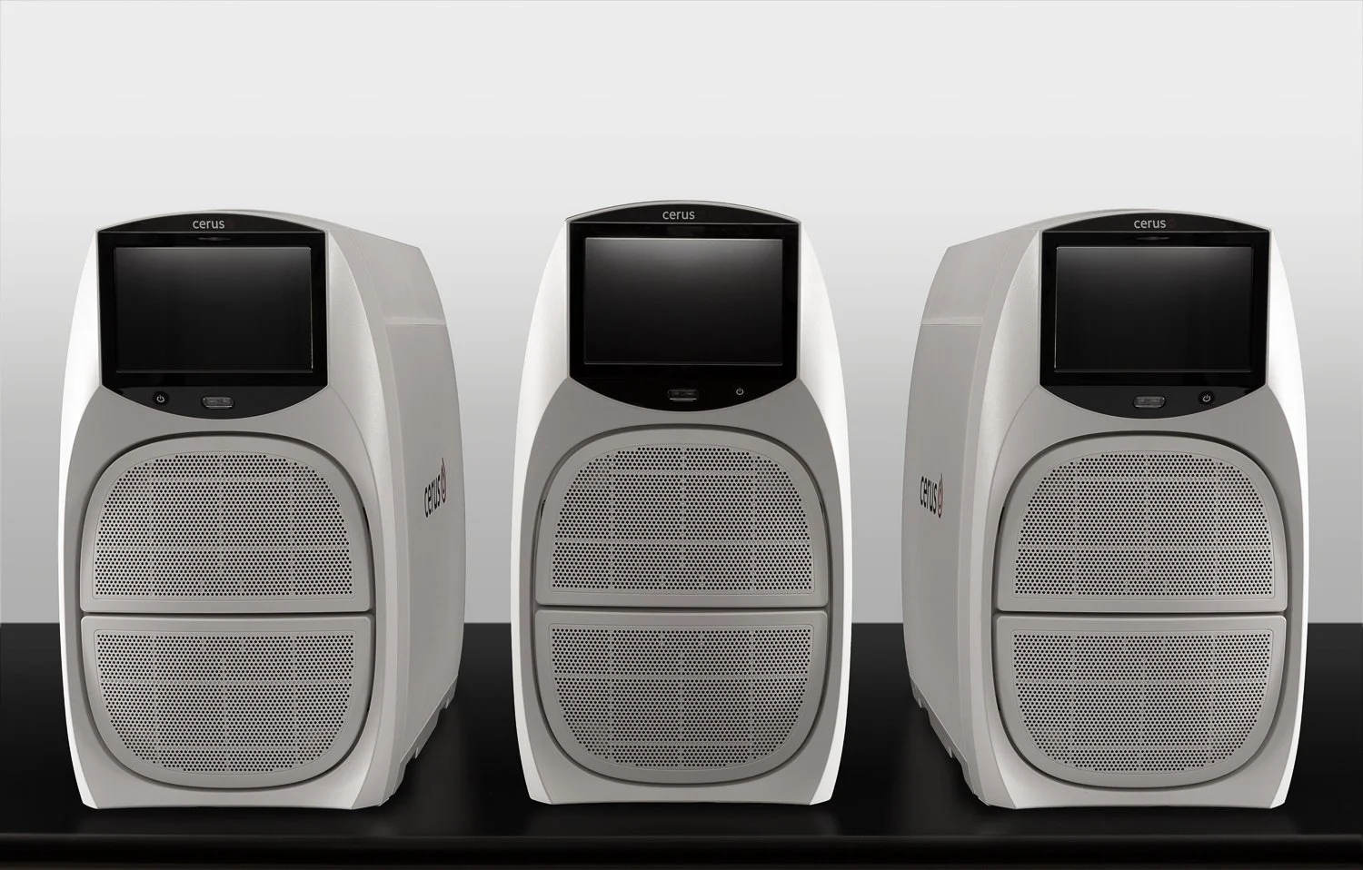 product photography hree Cerus medical illuminator devices lined up, front view studio photo