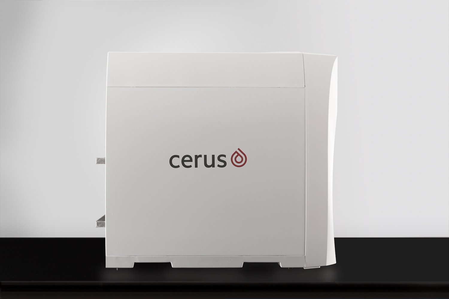 product photography Side profile of Cerus medical illuminator device, closed unit on lab counter
