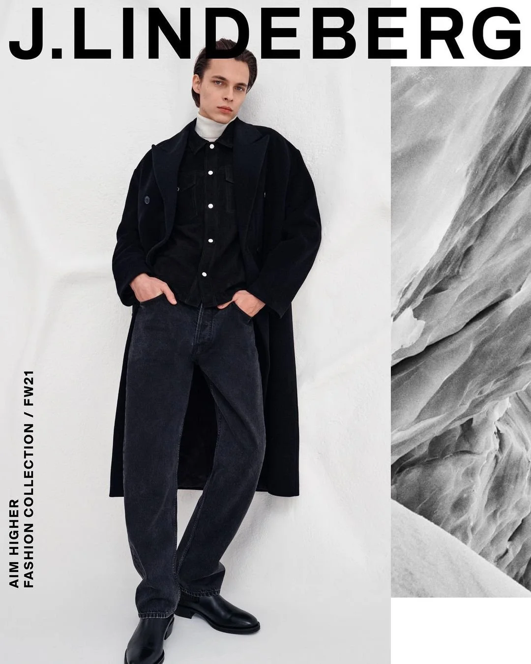 Fashion model standing against a white wall, wearing a black jacket, black jeans, and black boots, with text indicating J. Lindeberg brand and fall/winter 2021 collection.