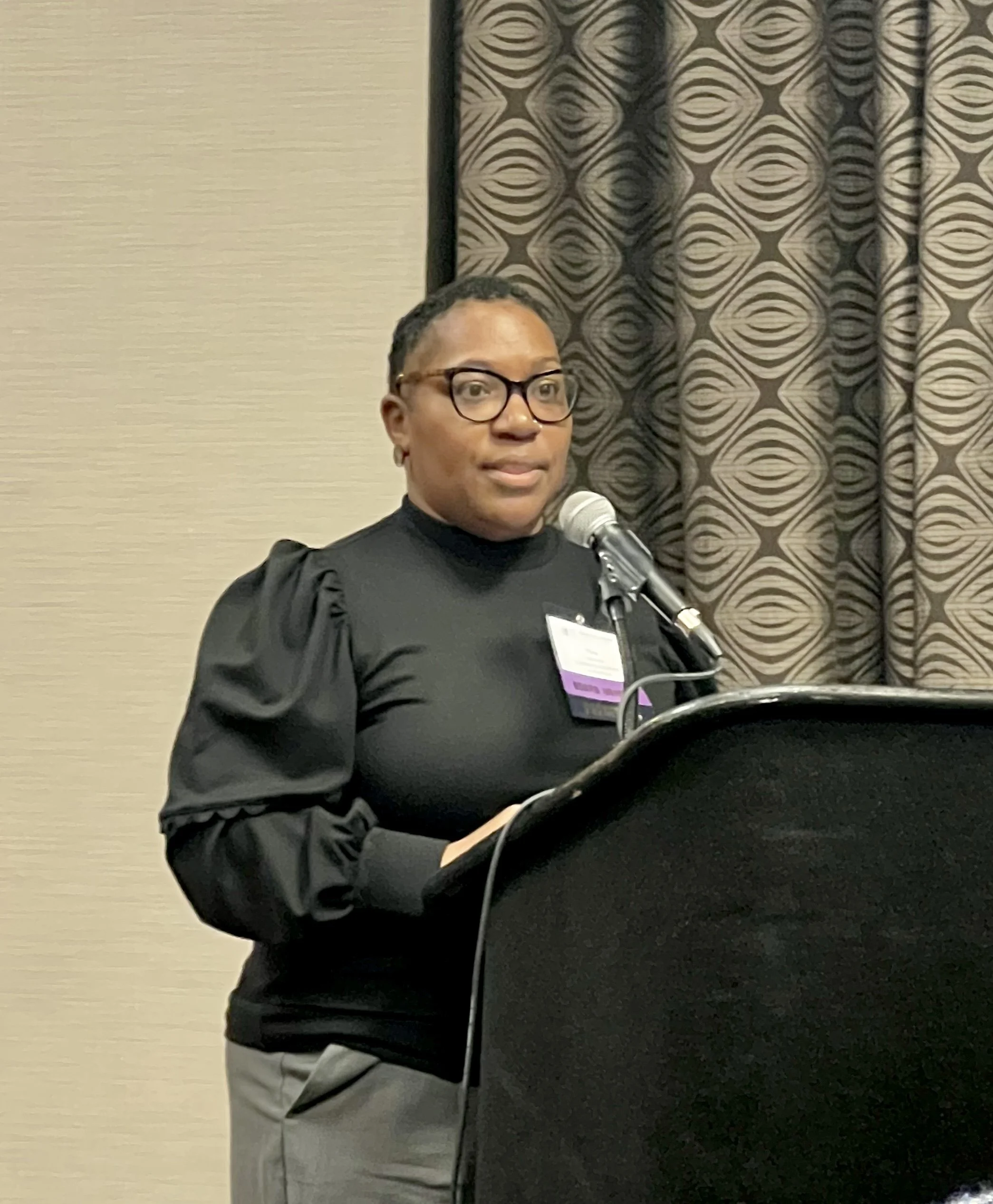 Tina Galloway, PharmD, Senior Director of Dispensary Services at Community Volunteers in Medicine & Director on the PCHC Board presenting on literacy, health literacy, and health outcomes.