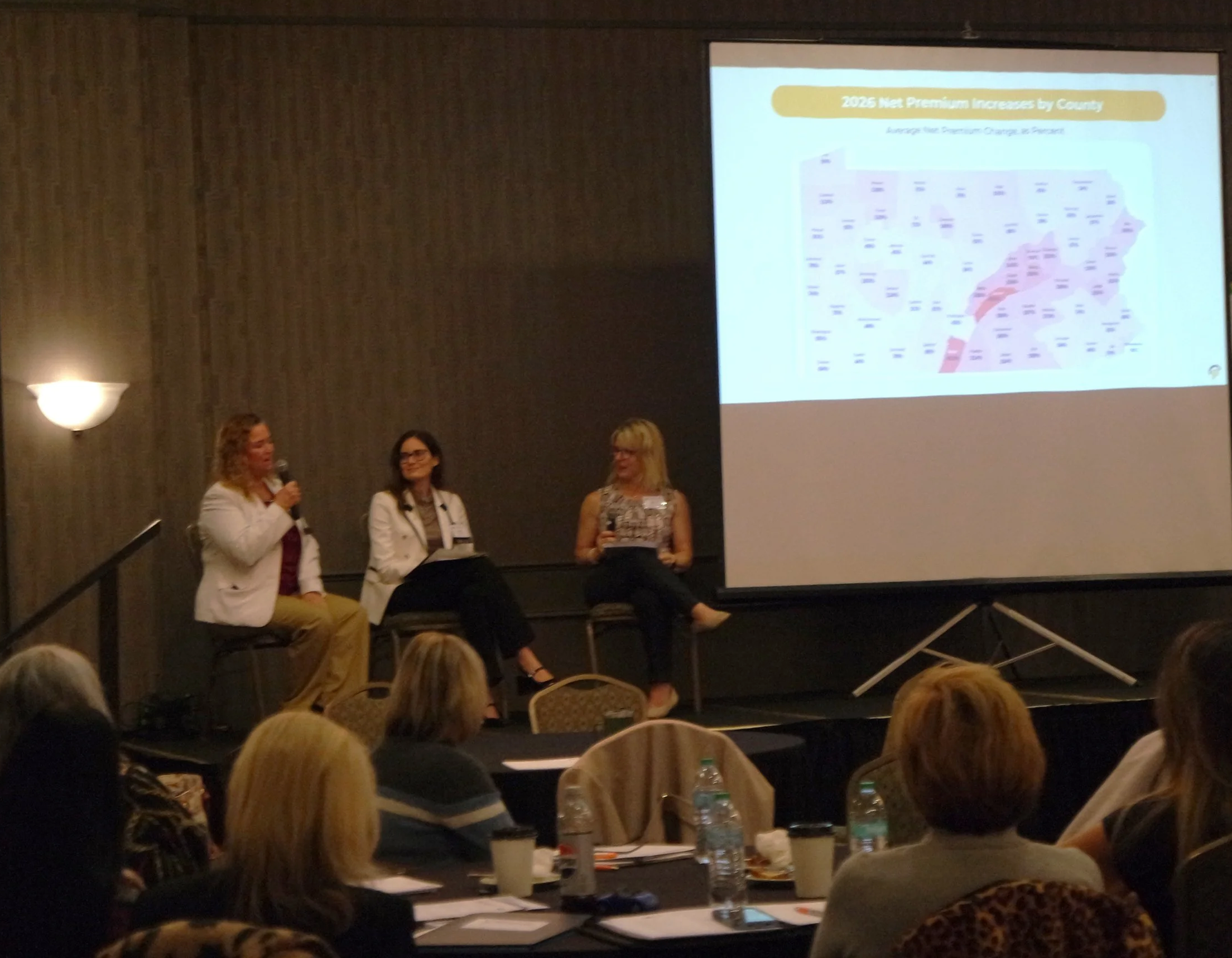 Opening plenary with map showing expected rate increases for health insurance policies offered on Pennie in 2026.