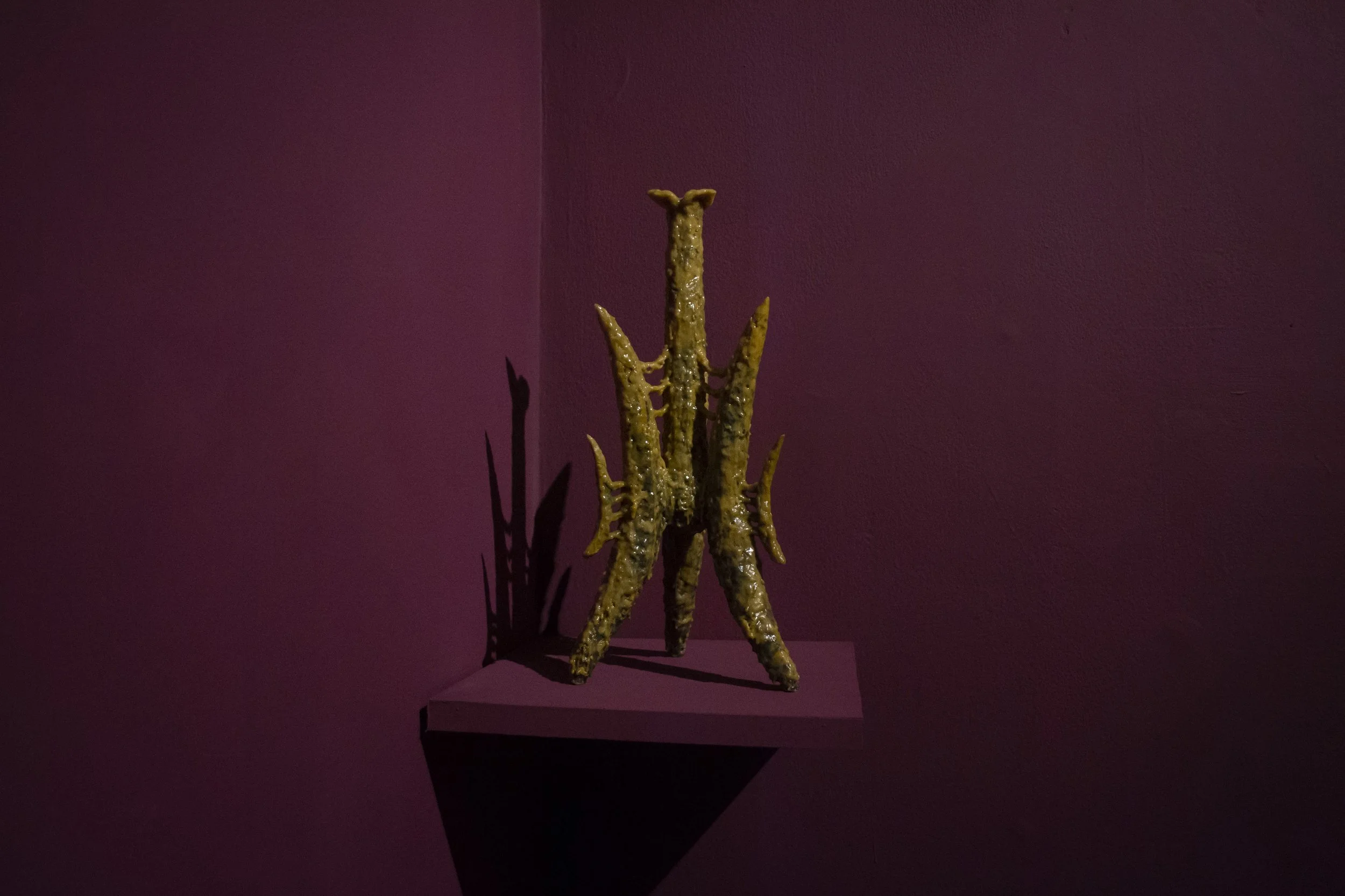   Artifact III,  2025 ;  beeswax, paraffin, oil paint, clay and varnish, 17 × 7 × 7 inches  