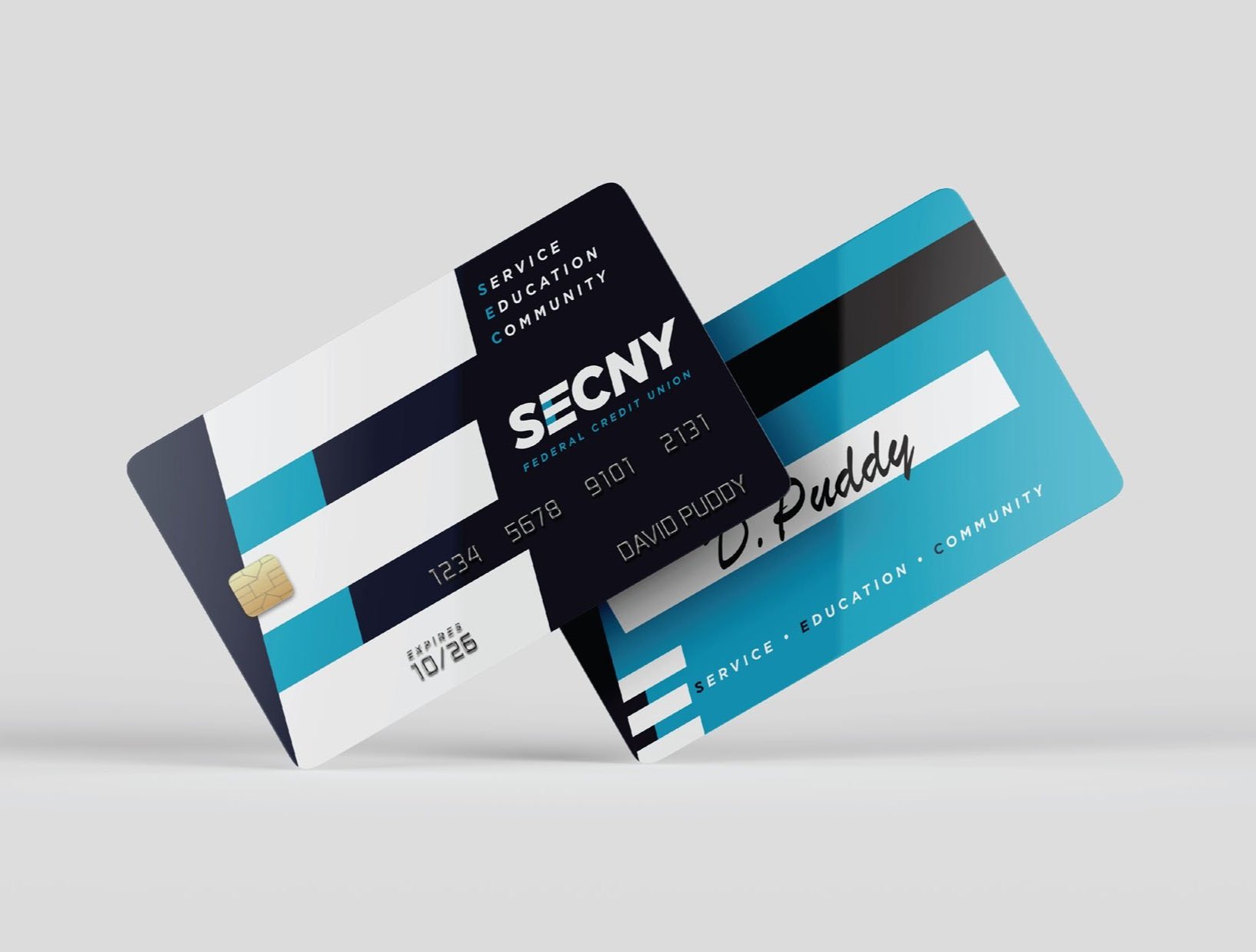 CINSYR | Creative design agency Syracuse, New York | SECNY federal credit union brand identity mockup branded credit cards with the "E" design and brand colors