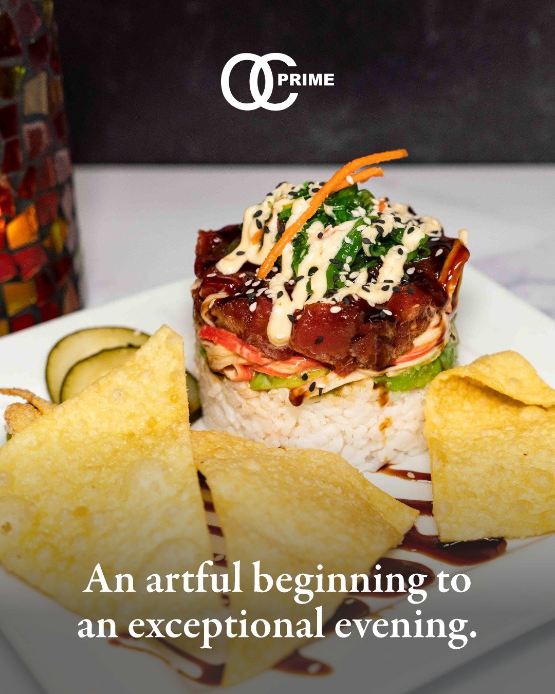 Our Ahi Tuna &amp; Spicy Crab Sushi Tower &mdash; layers of marinated ahi tuna poke, spicy crab salad, sushi rice, avocado, pickled cucumber, and wonton chips, elegantly finished with spicy mayo, unagi sauce, and wasabi. A dish as stunning as it is i