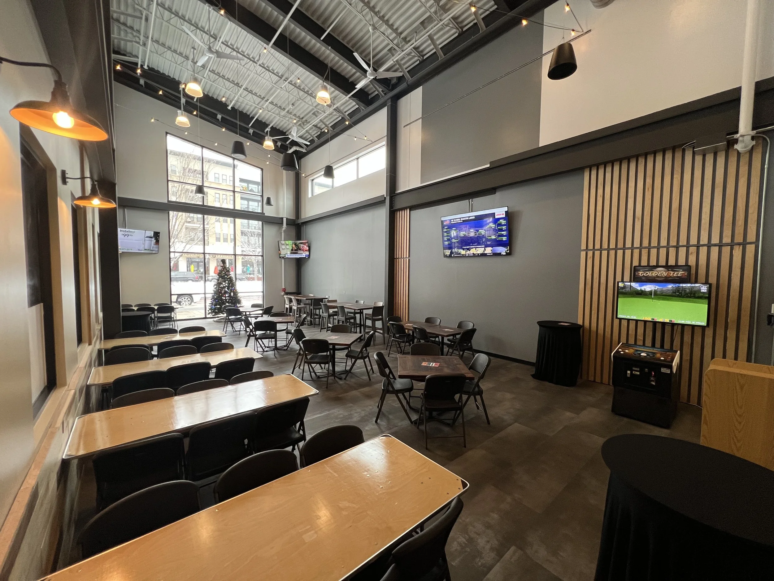 Monon Hall at Sun King Carmel Large room with tables and chairs for event space