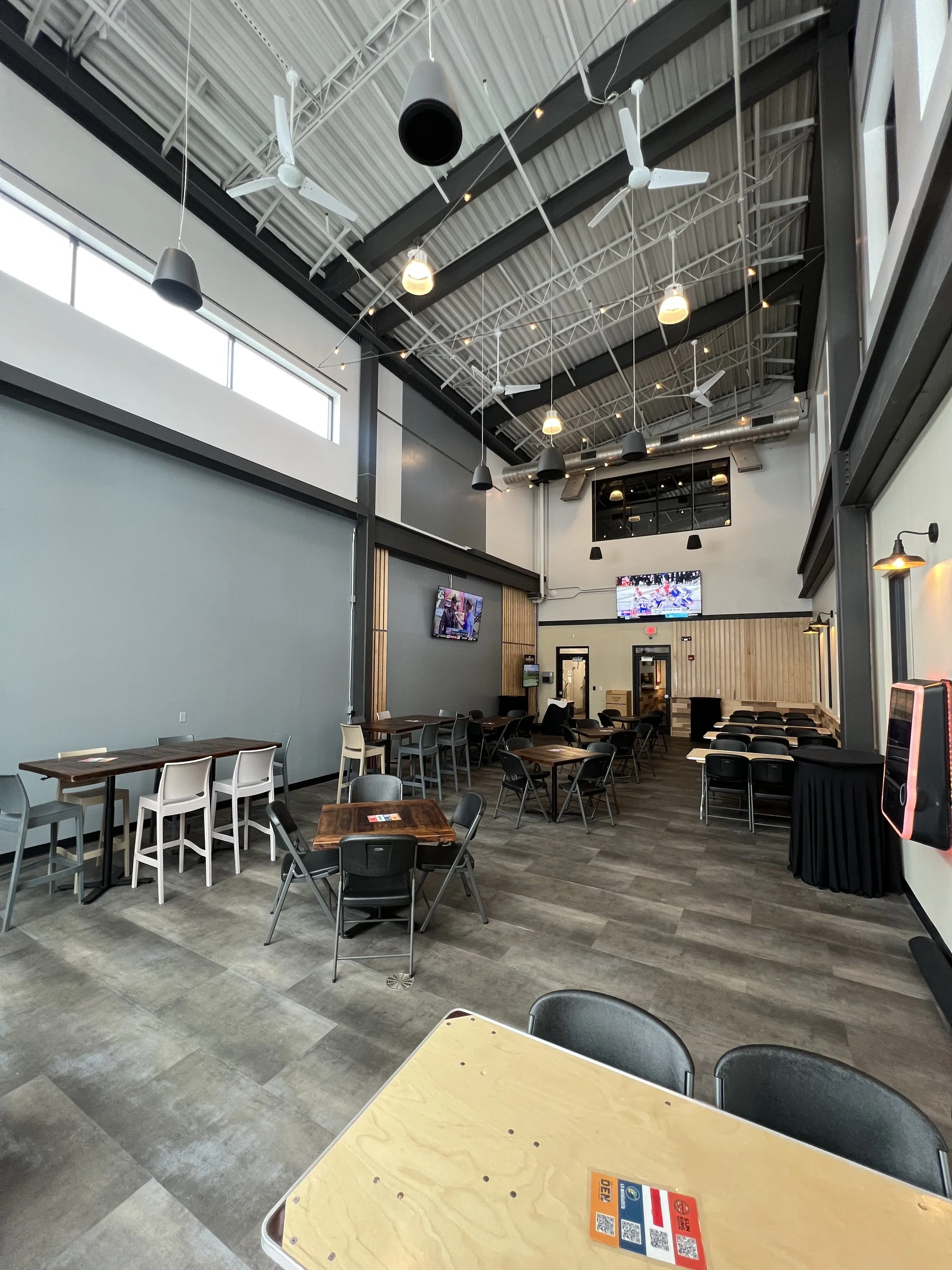 Monon Hall at Sun King Carmel Large room with tables and chairs for event space