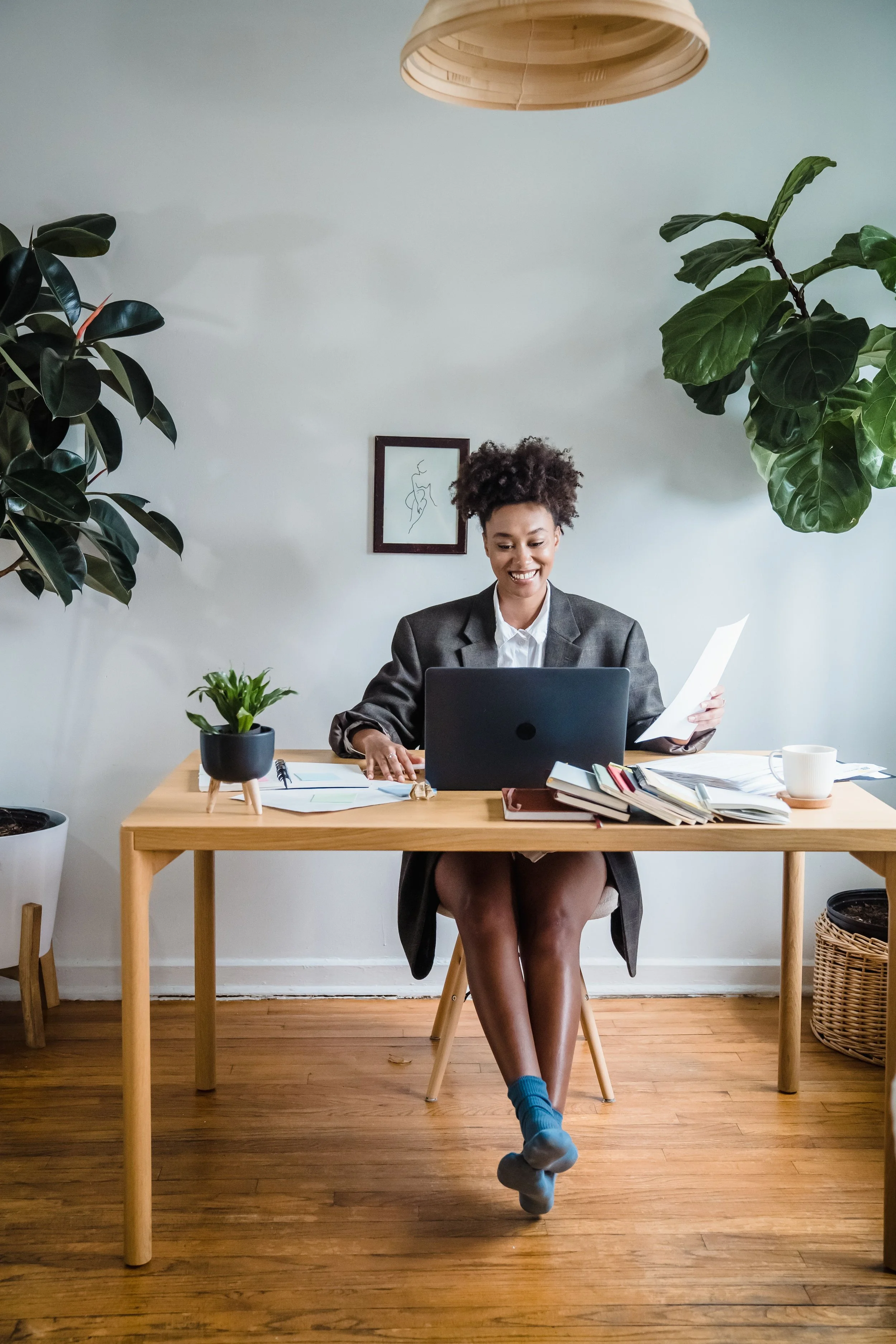 female founder ready to outsource email marketing sitting at desk