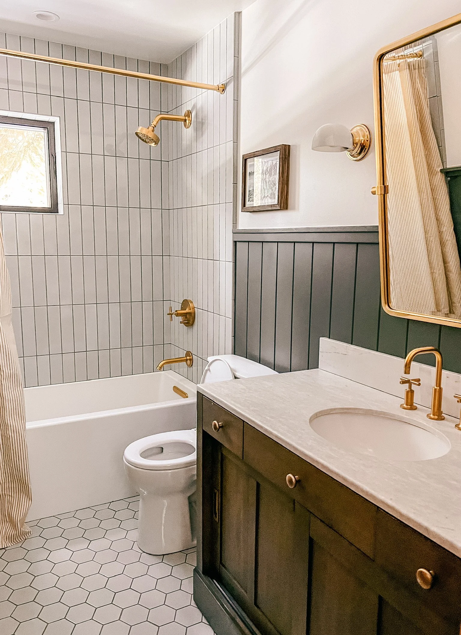 Renovated Cabin Bathroom Downstairs with Bath and Shower, and Heated Floors for your toes.