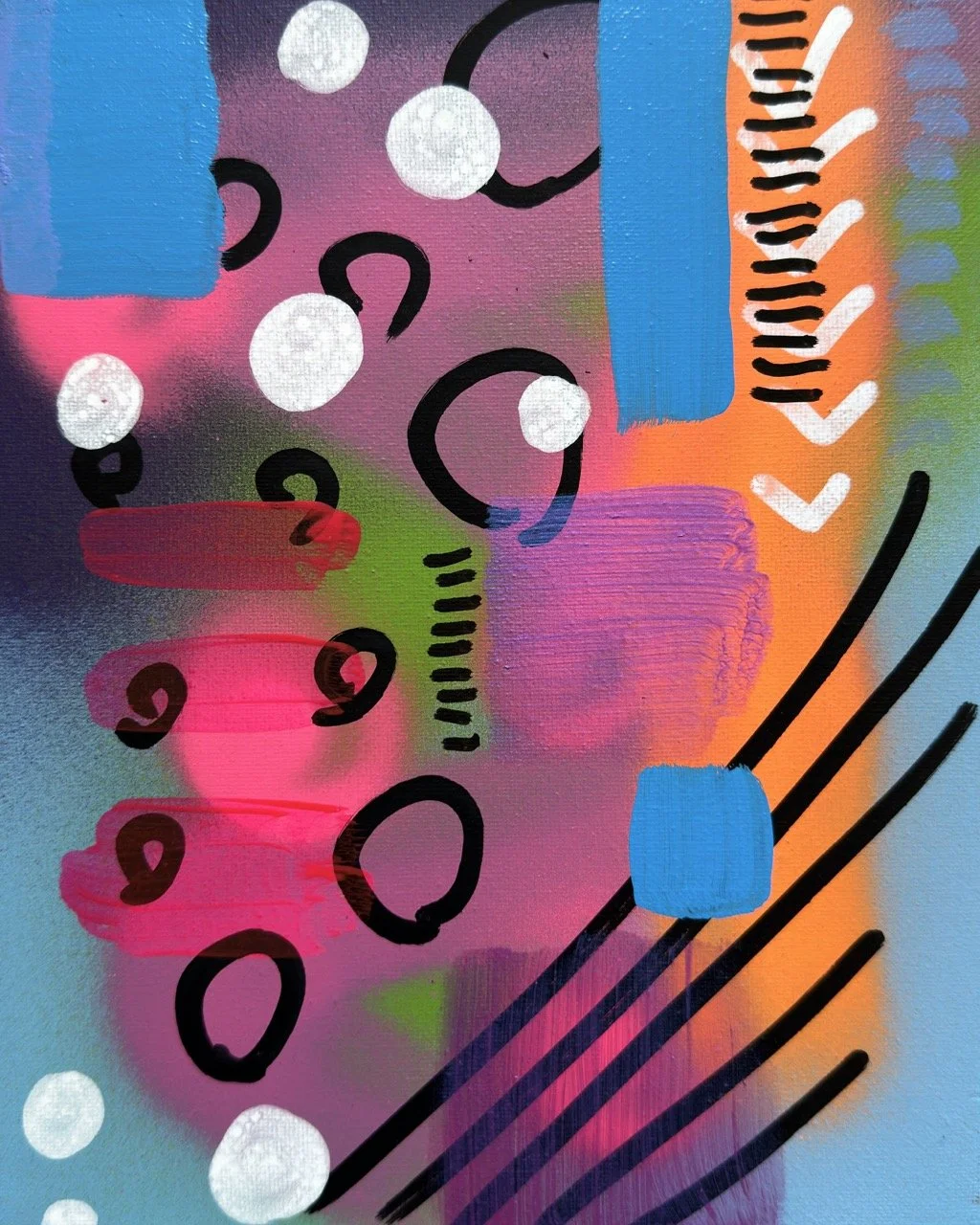 Abstract graffiti art with pink, blue, orange, black, and white spray paint, featuring shapes like circles, lines, dots, and blocks.