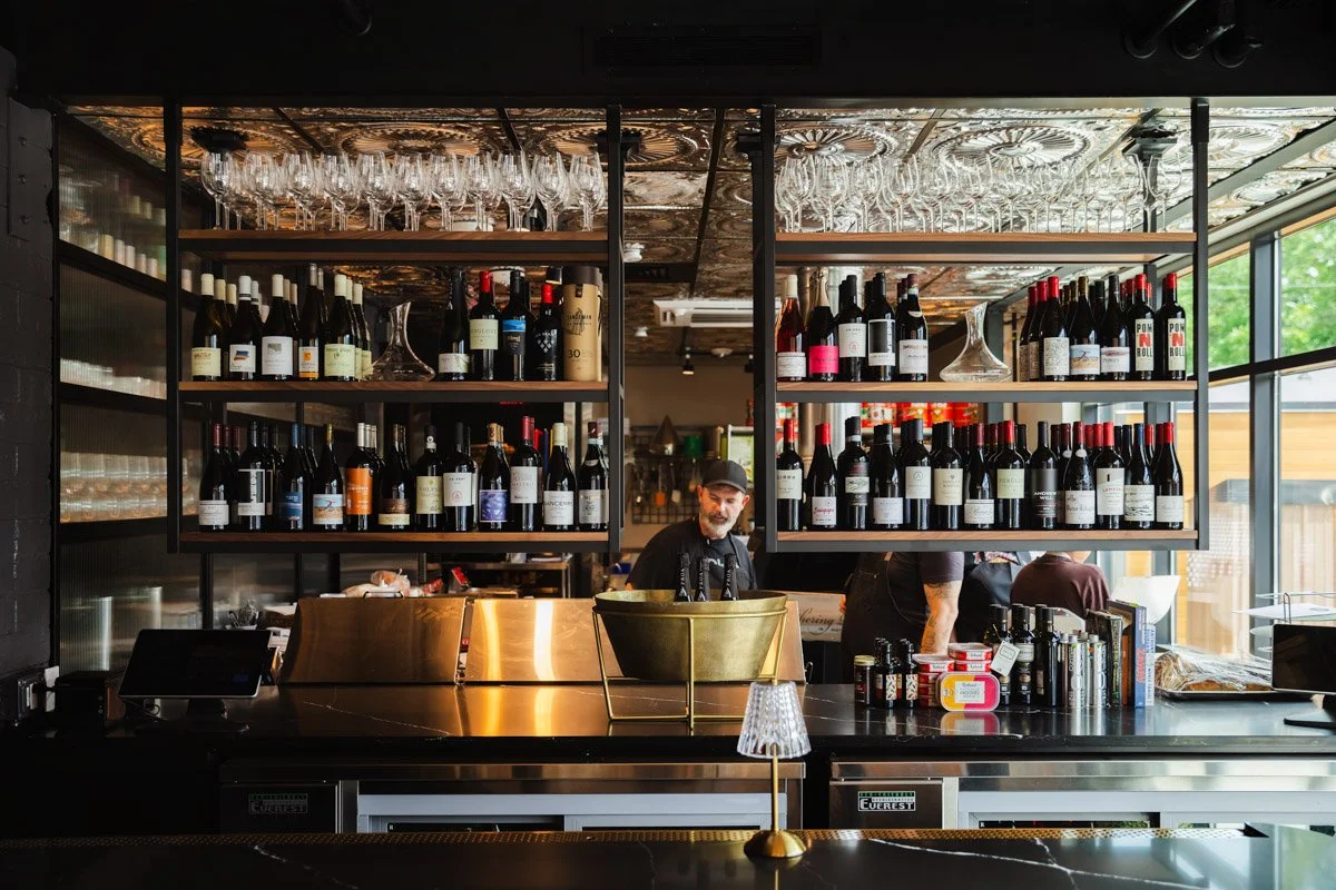 Photo of various wines on shelving